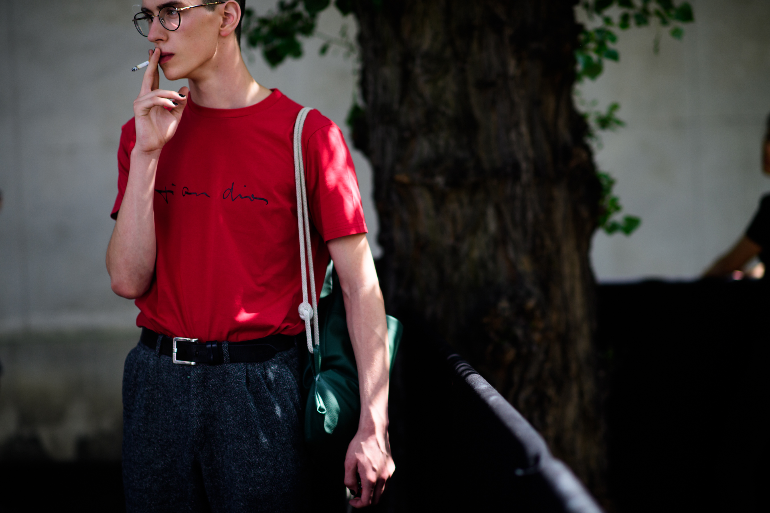 Male model smoking outside show