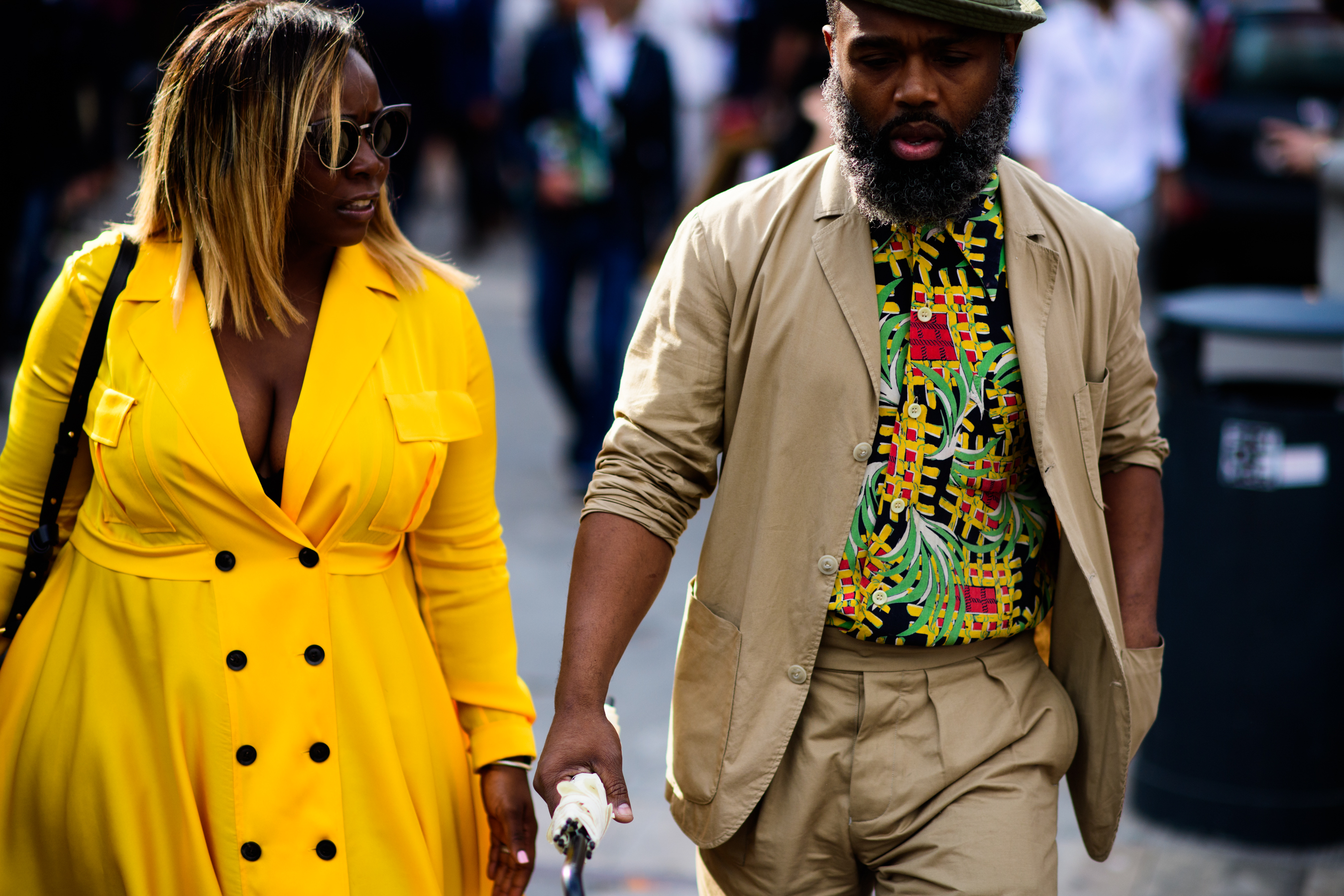 A woman in a yellow dress with a man