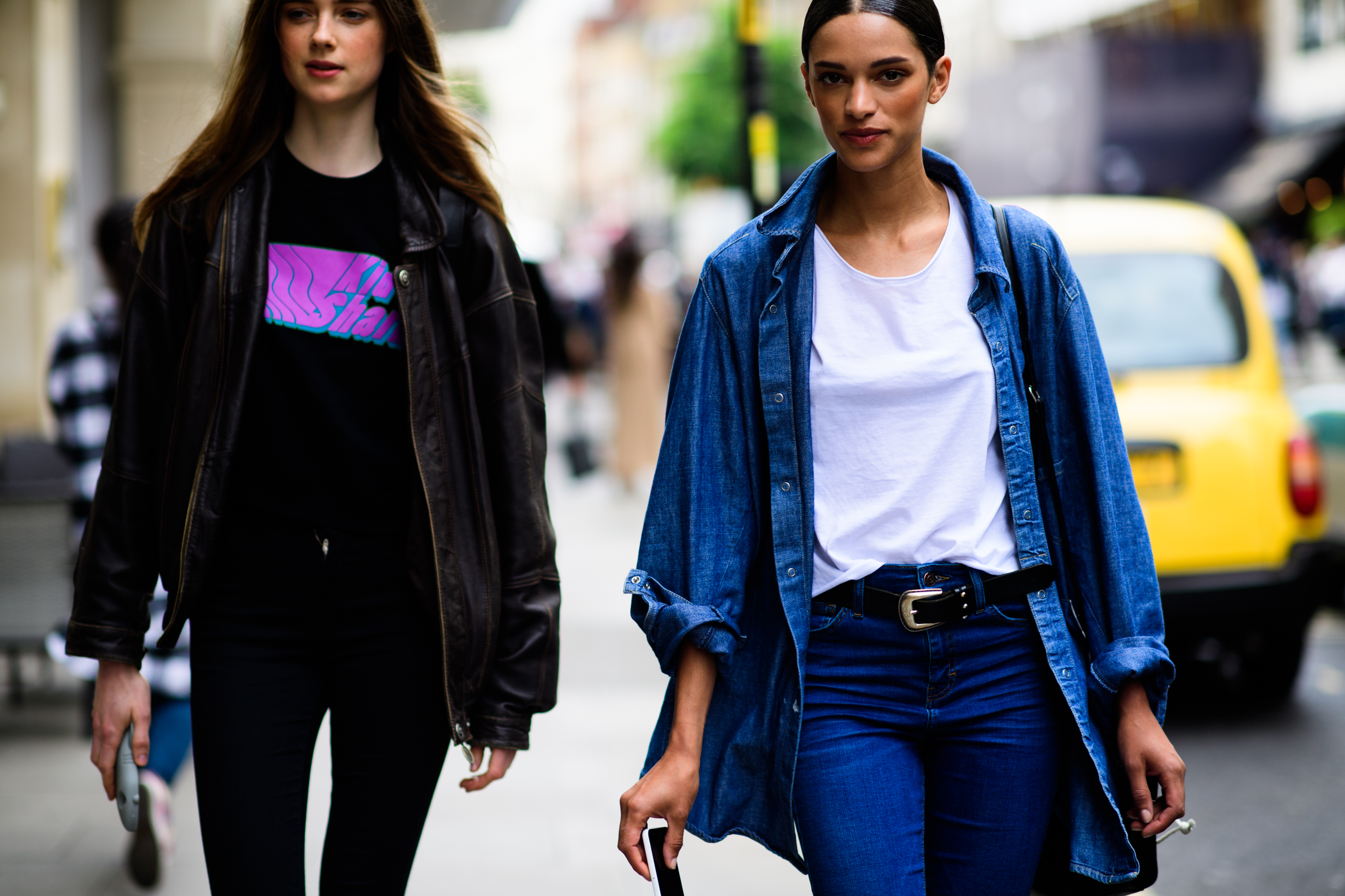 Two models in denim and leather