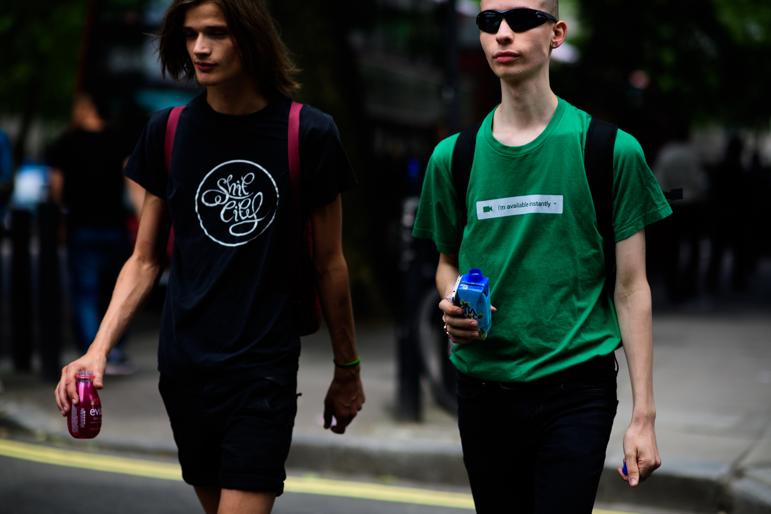 Two male models walking after the show