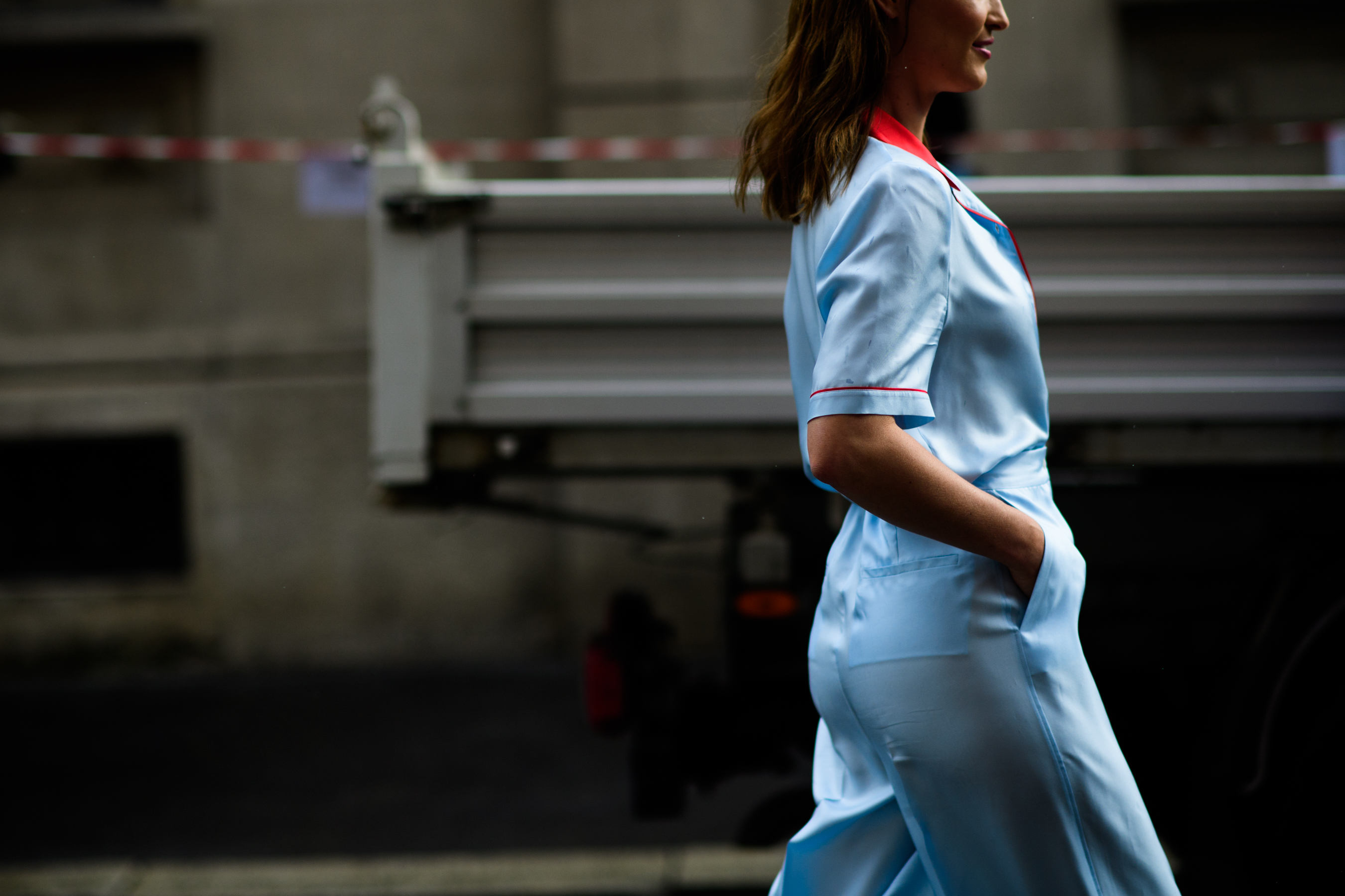 A woman in a silk light blue outfit