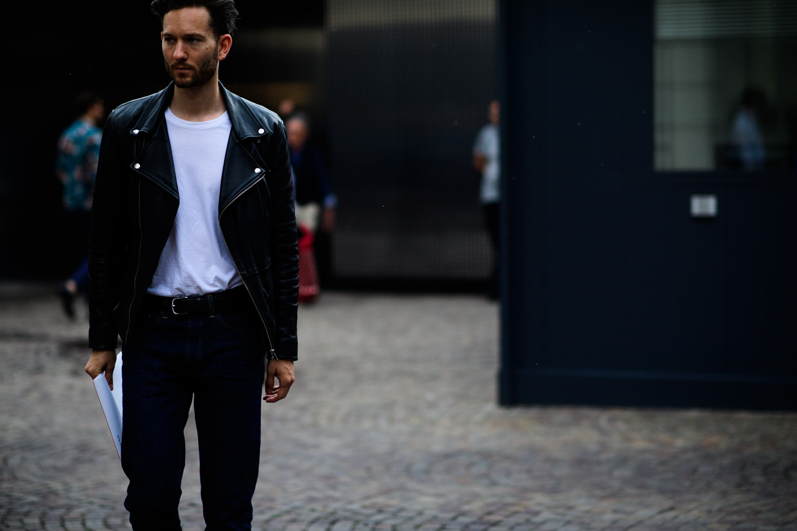 A man in a black leather jacket