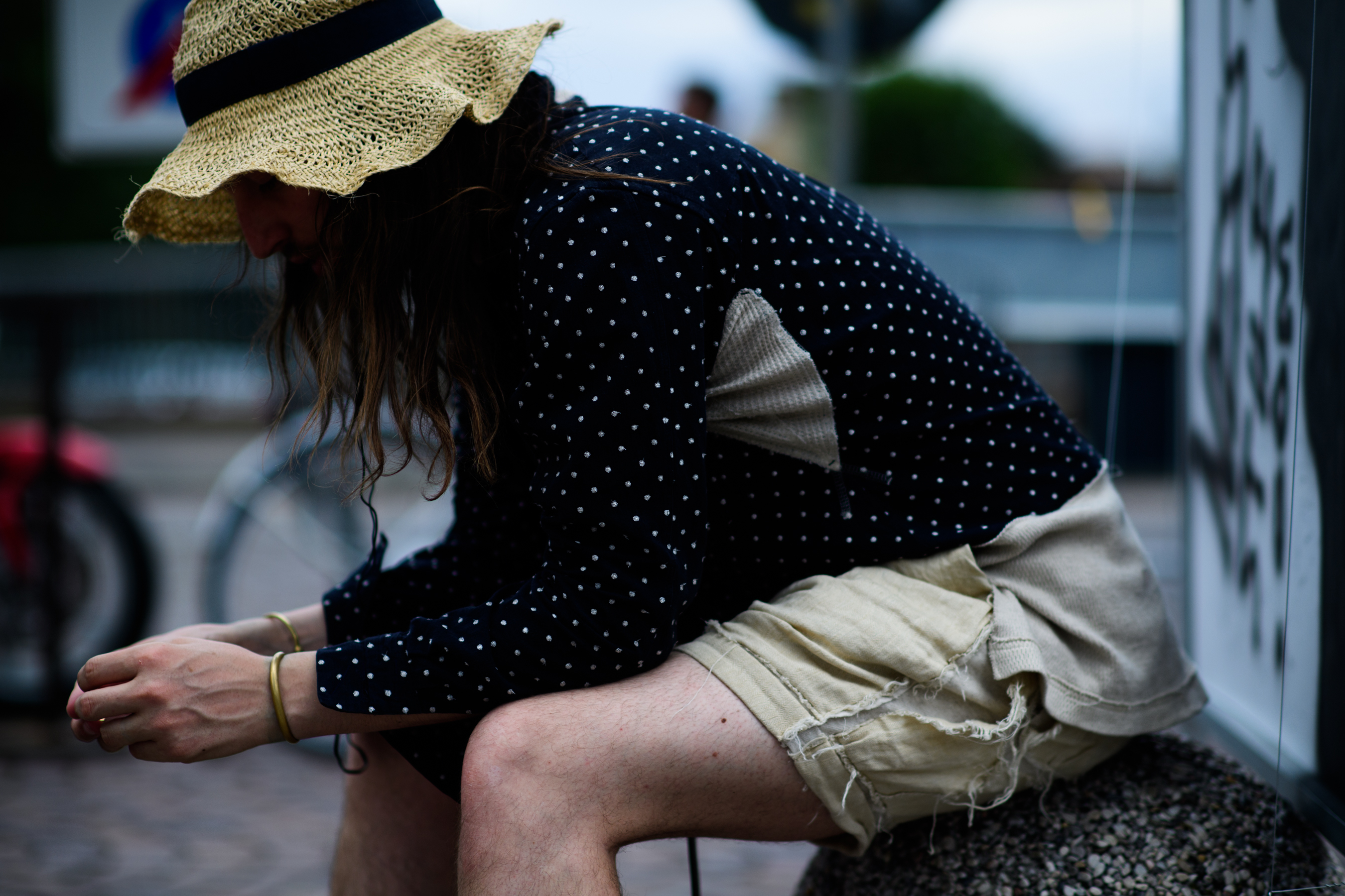 A man in a blue shirt with dots
