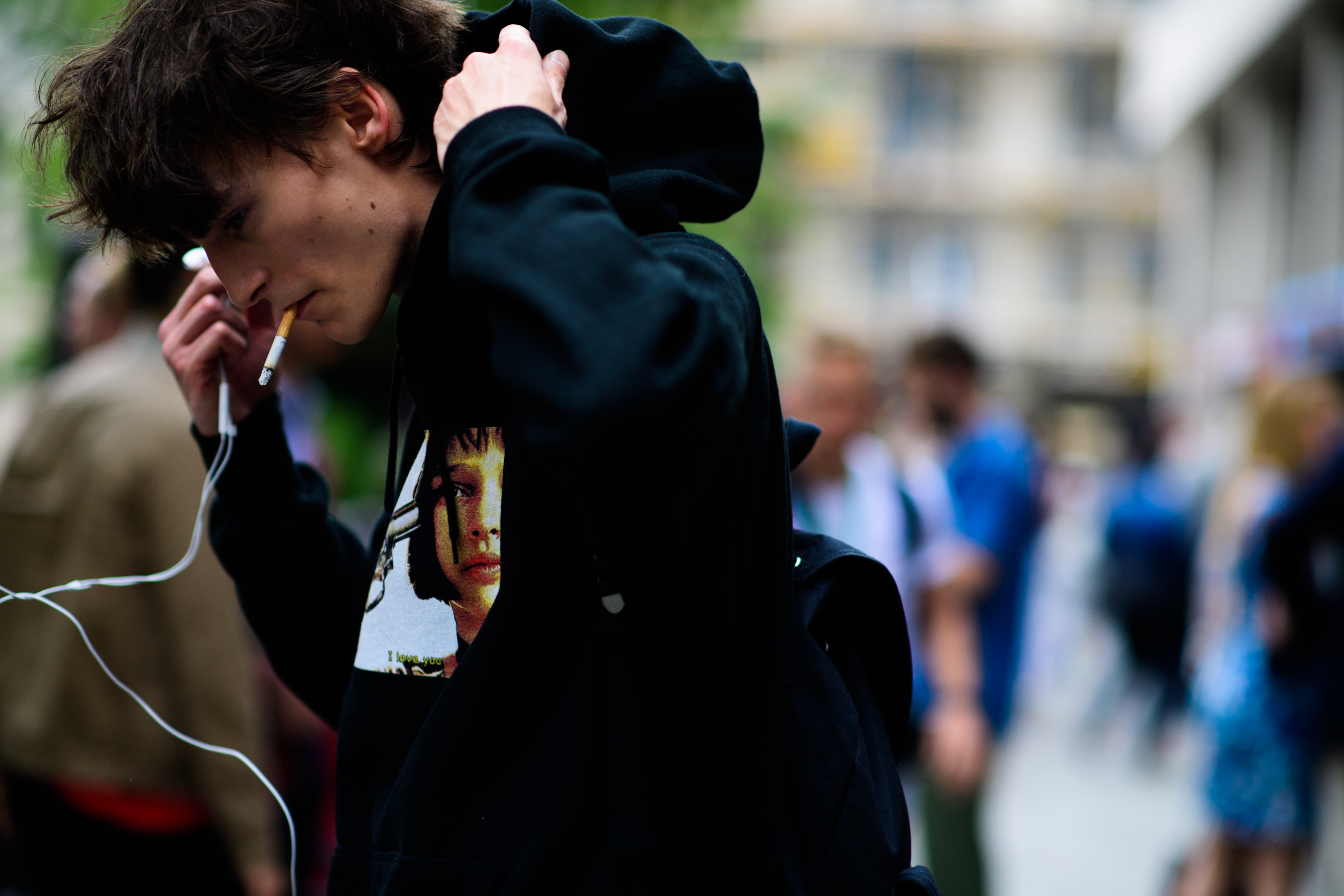 Male model wearing a green hoodie