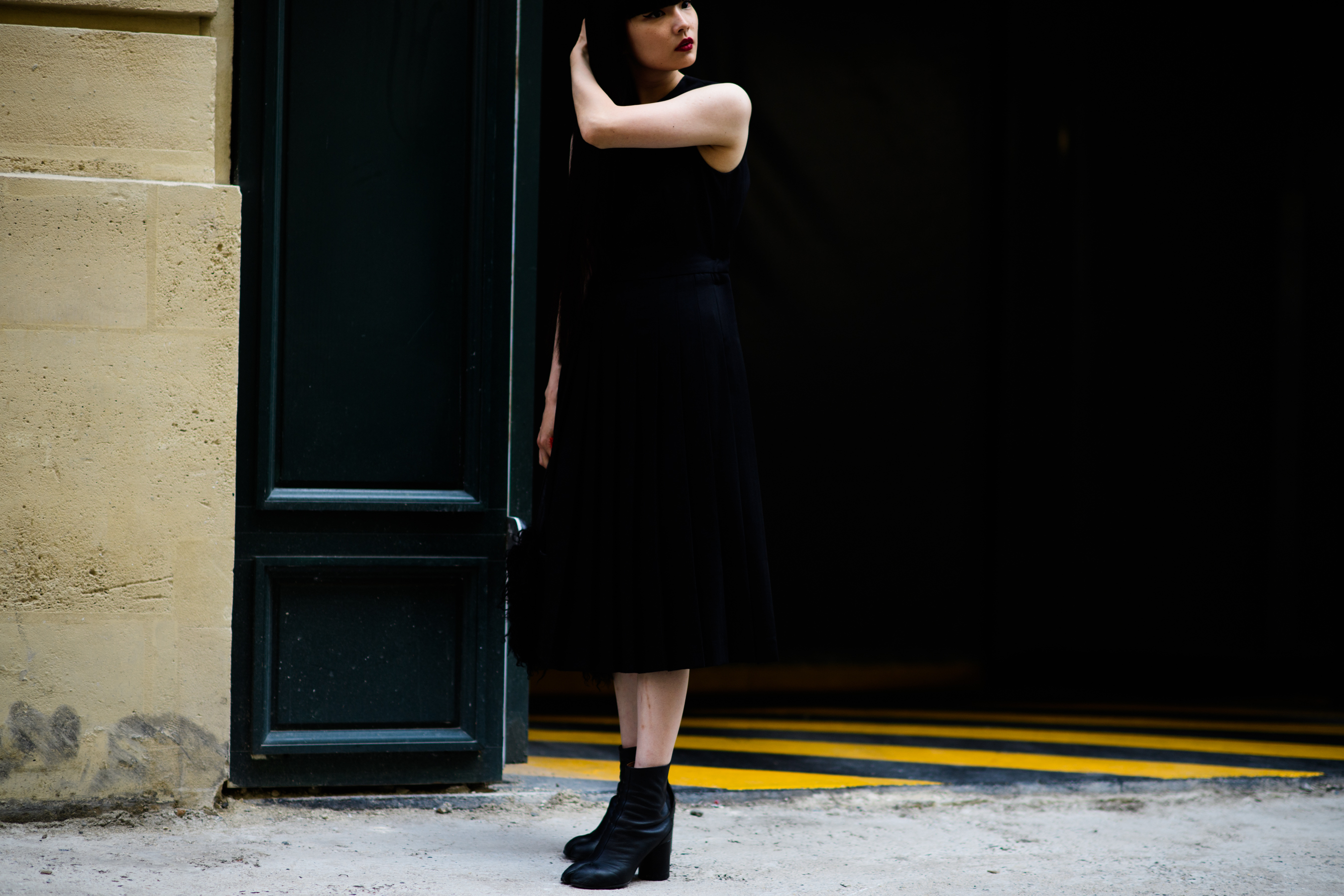 A young woman wearing all black