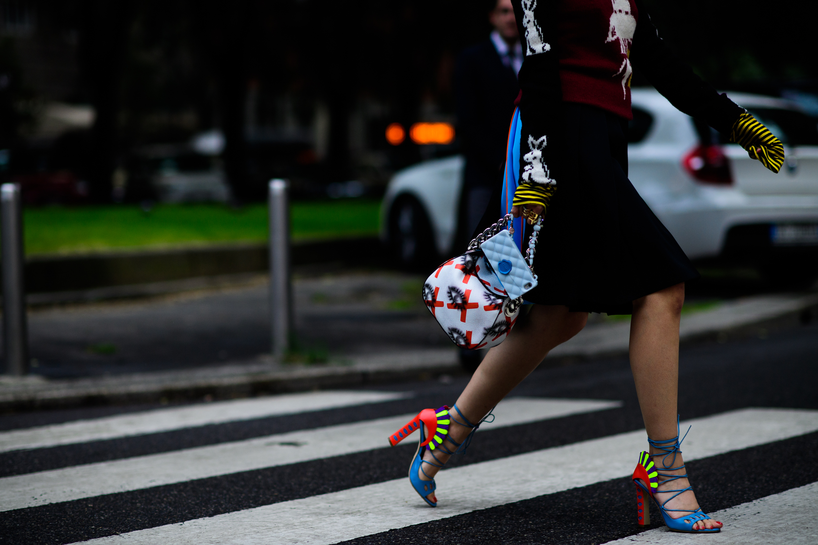 A woman in bright colourful shoes