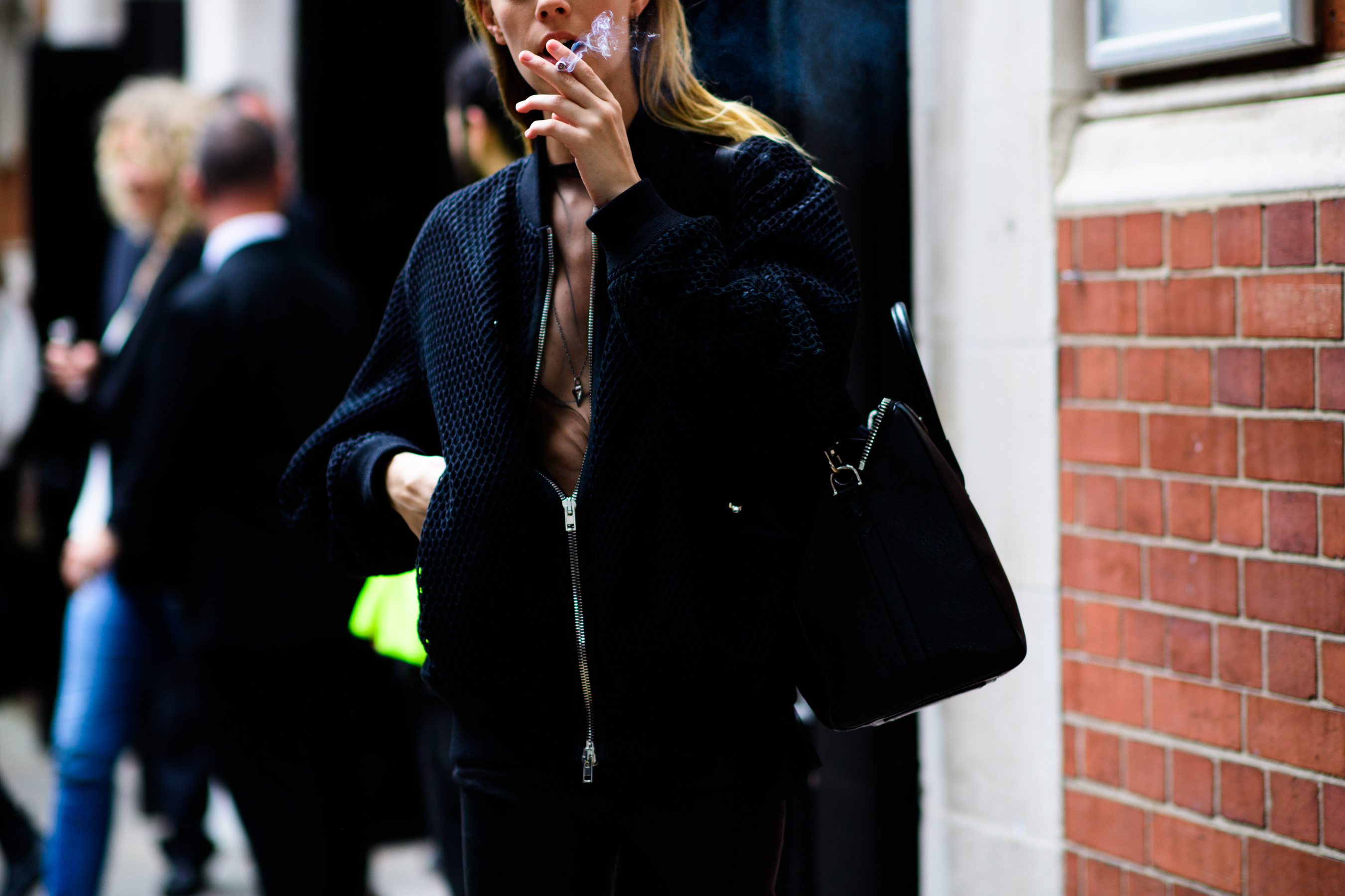 A model in an all black outfit