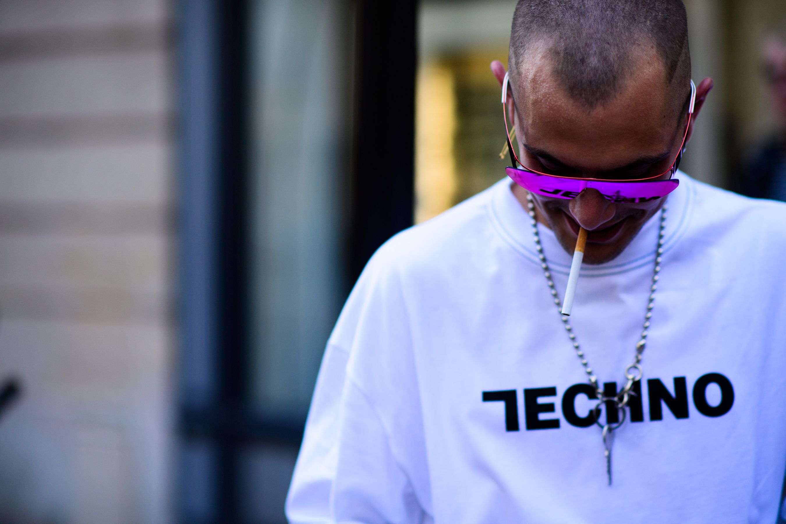A man in purple sunglasses