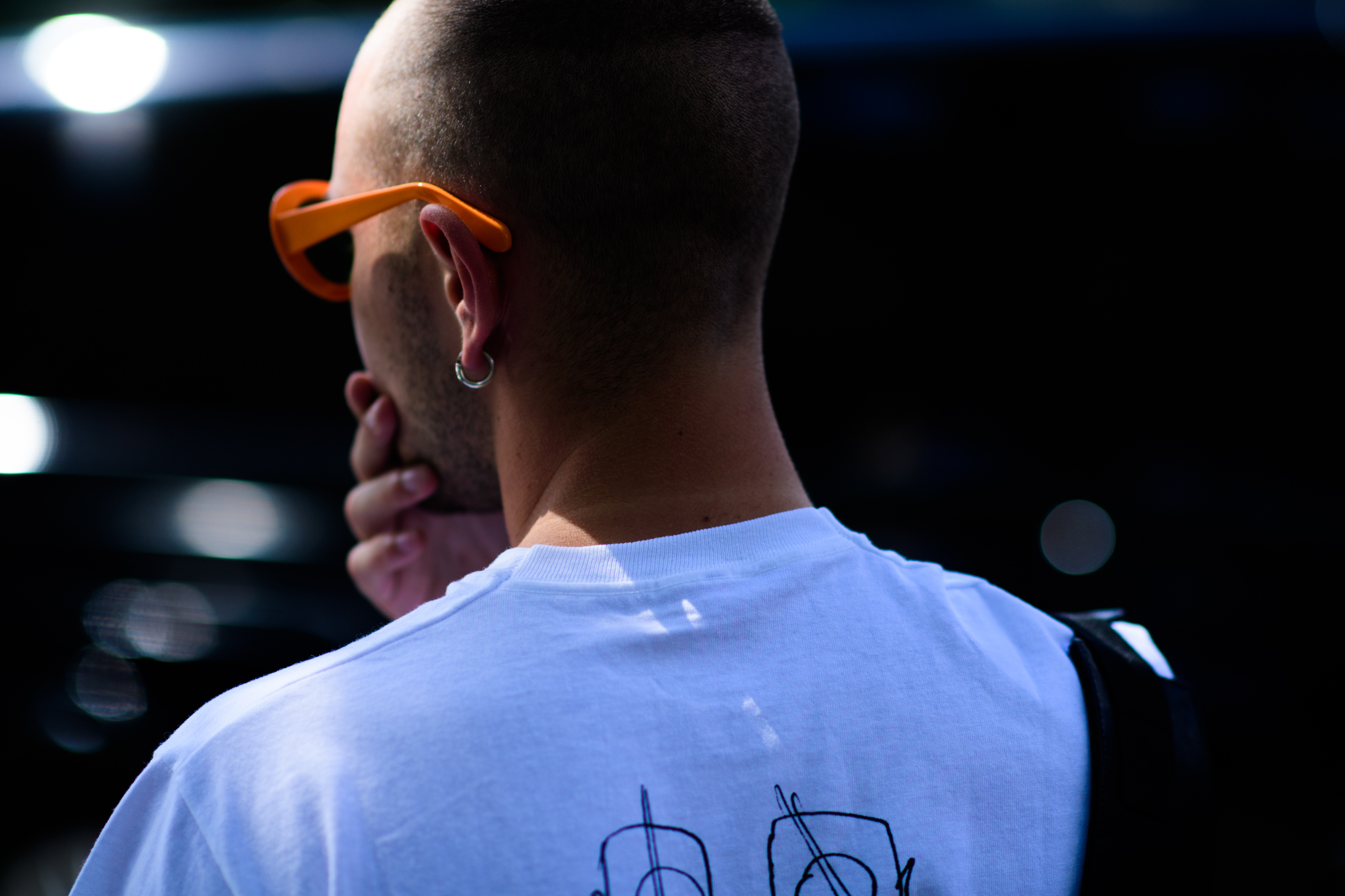 Male editor wearing orange sunglasses