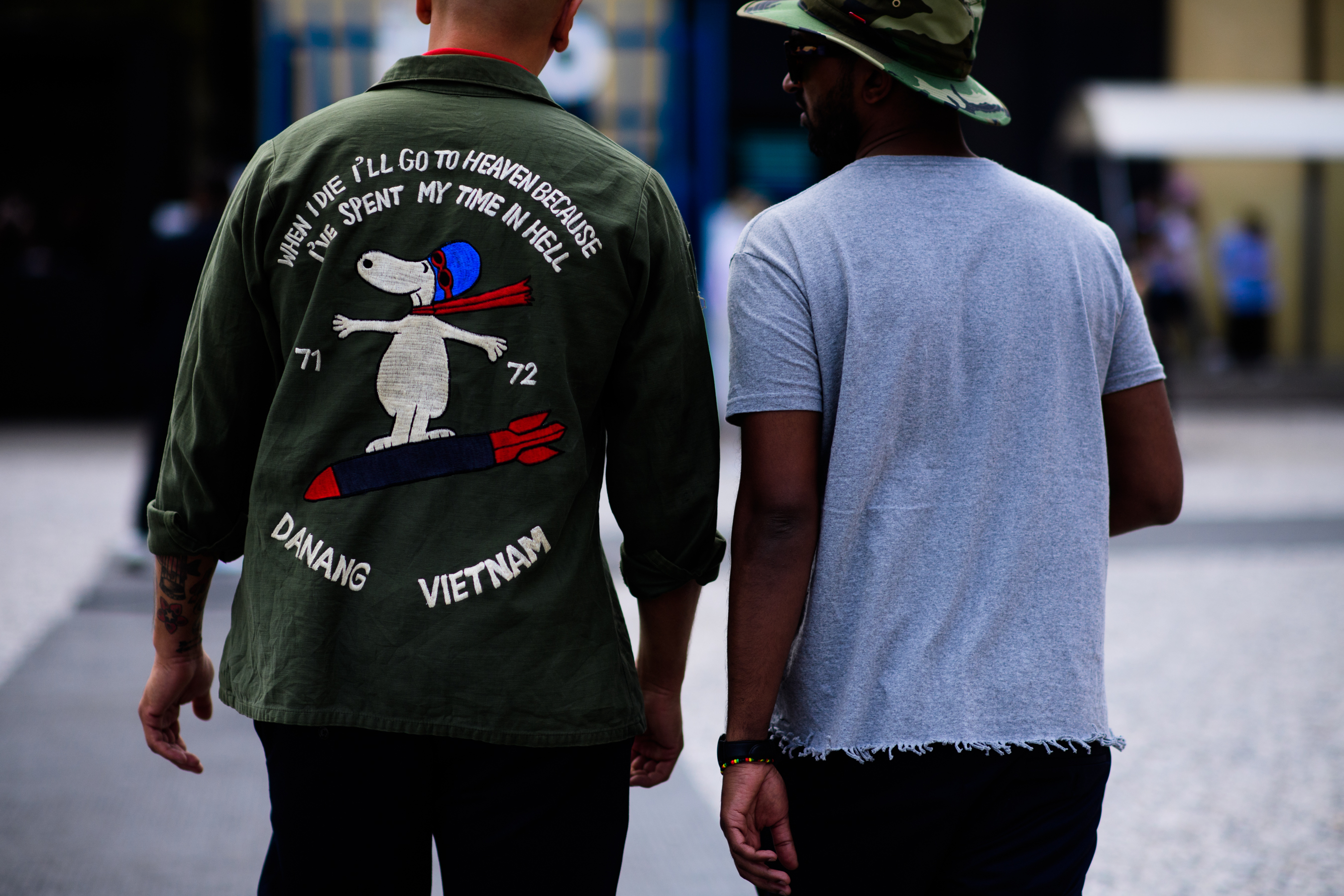 Two men walking together outside