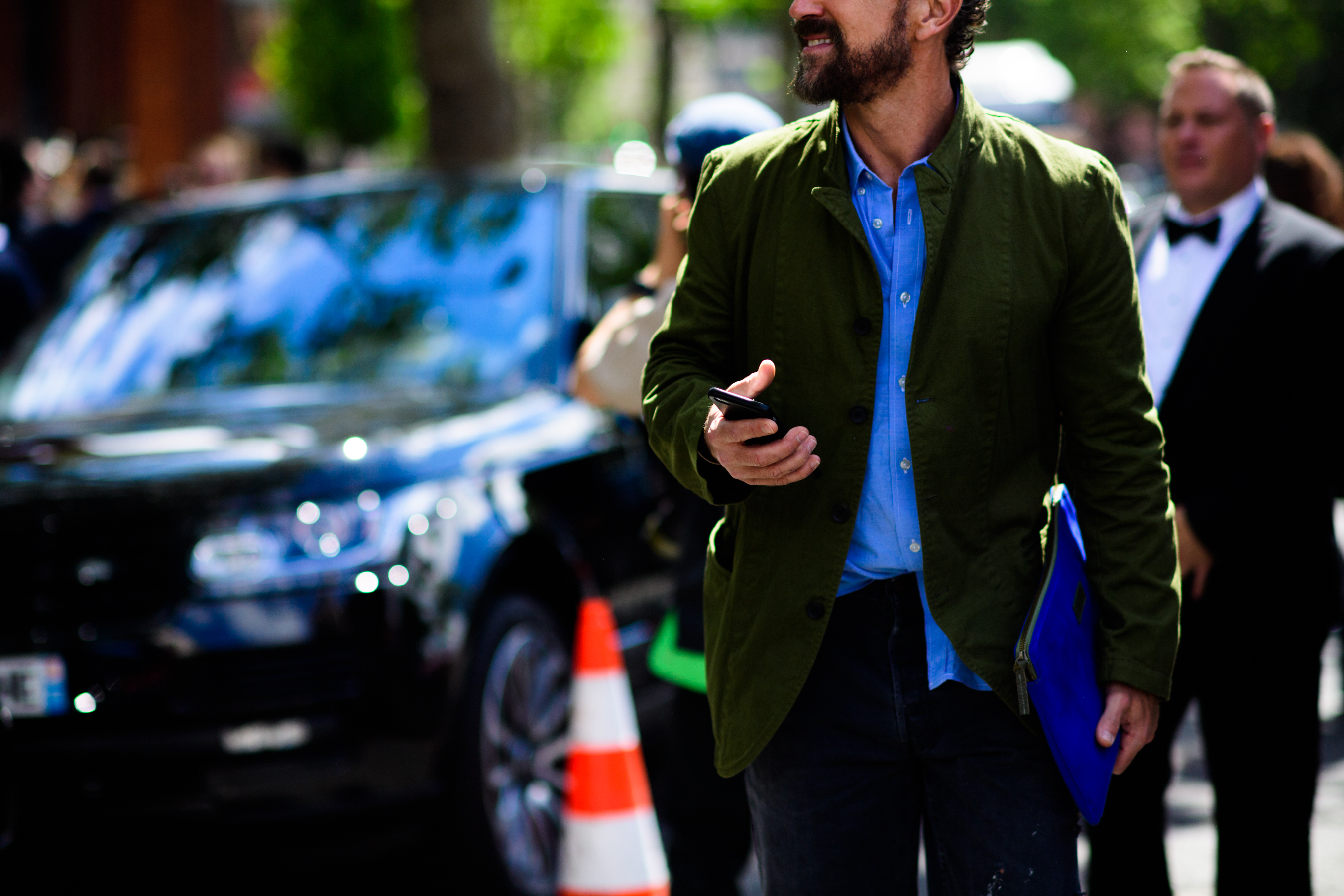 Man in green jacket outside