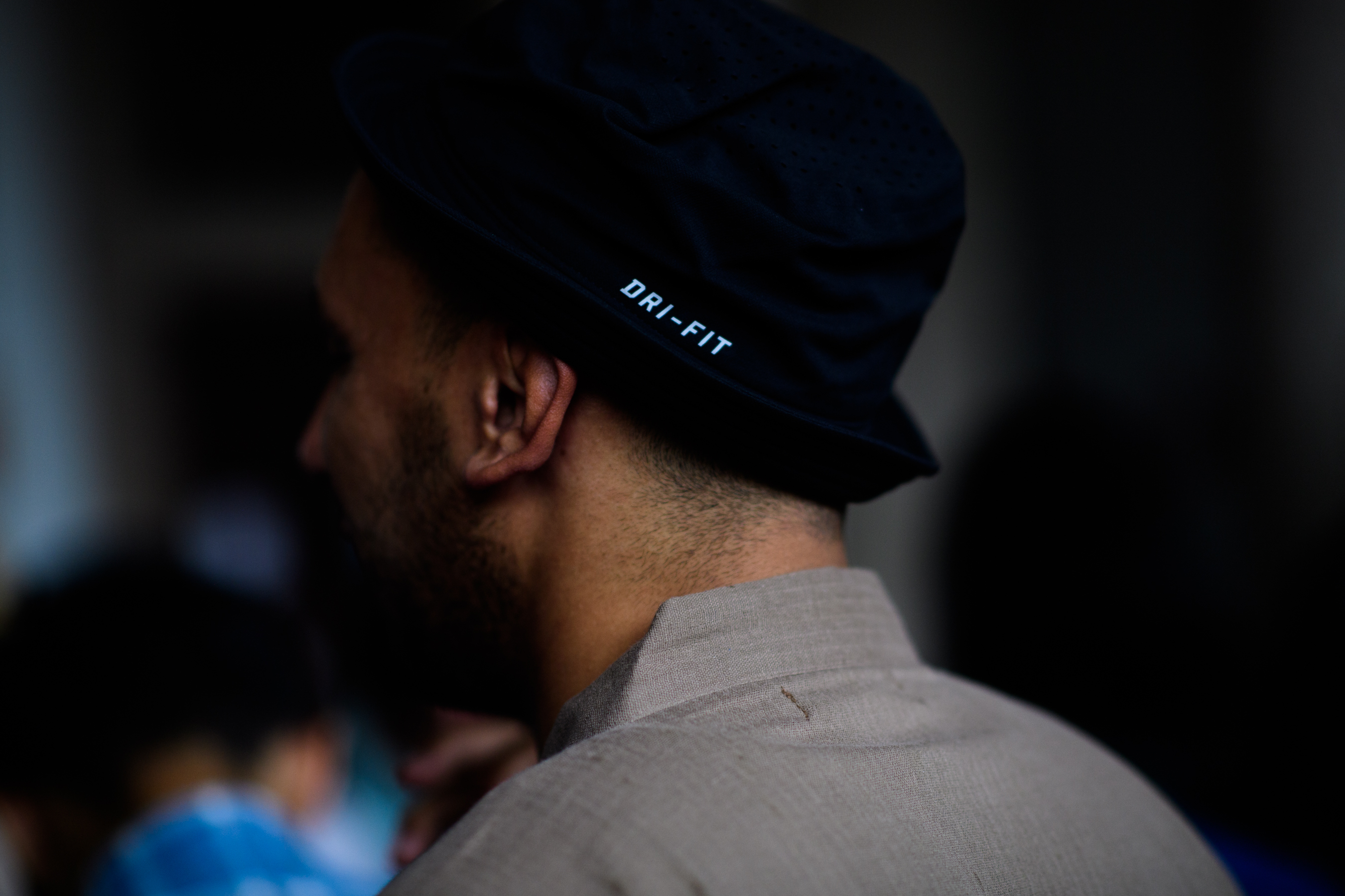 S man in a dark blue hat