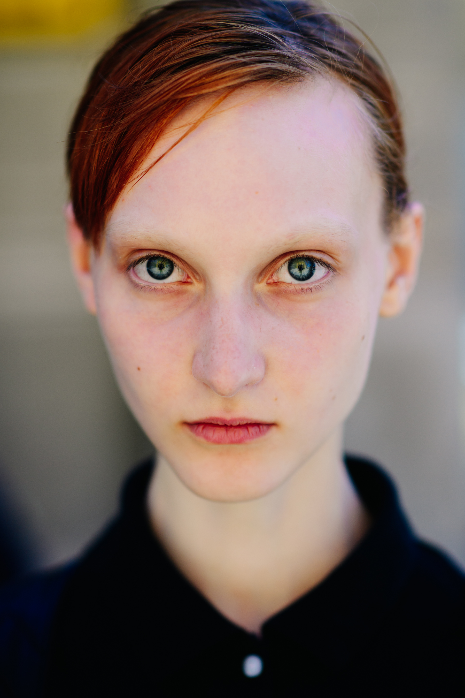 A red-haired girl with bright eyes