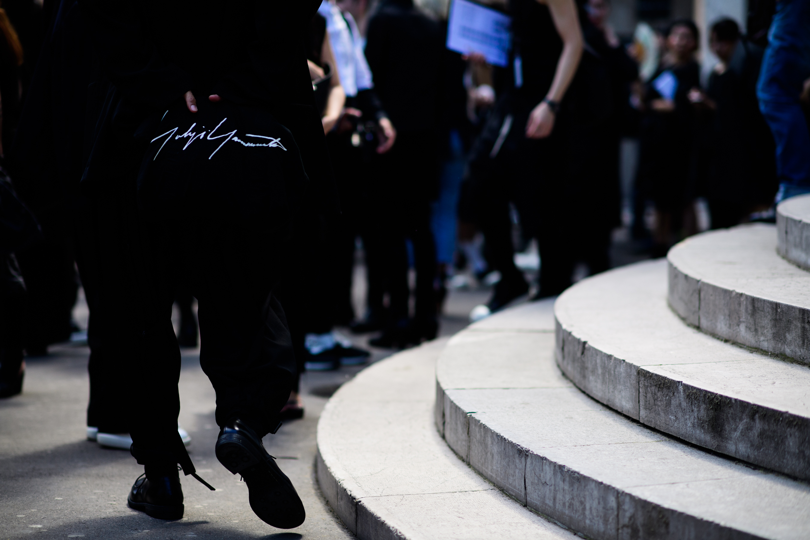 A man wearing all black walking