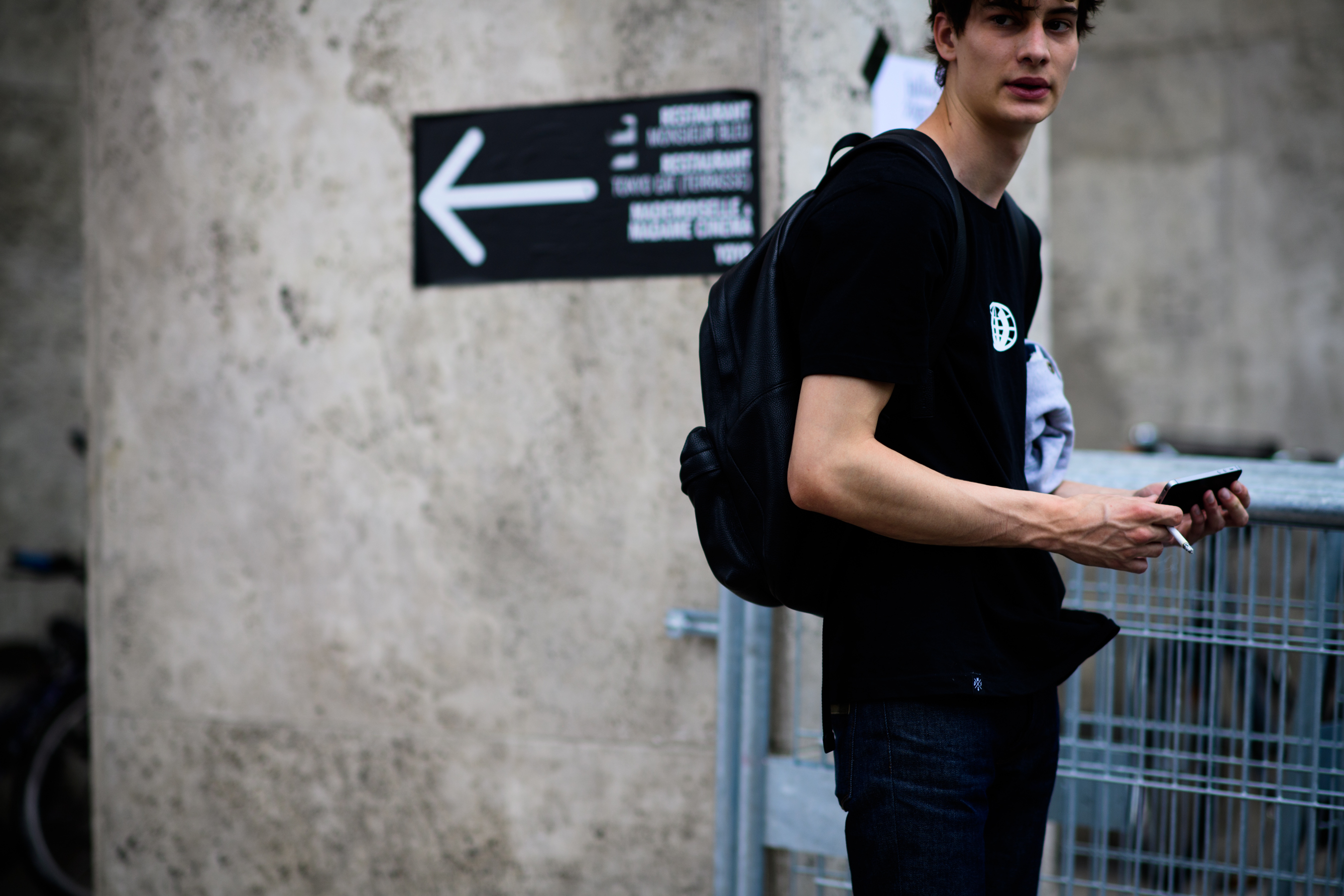 A male model wearing all black