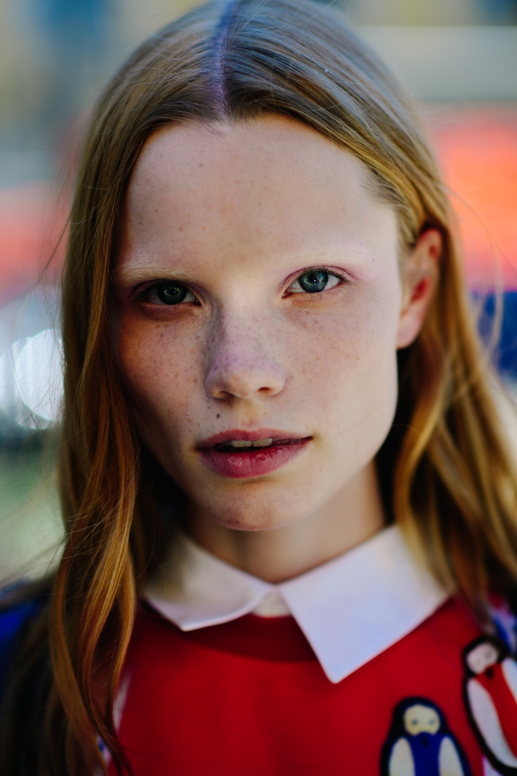 A red-haired model with freckles