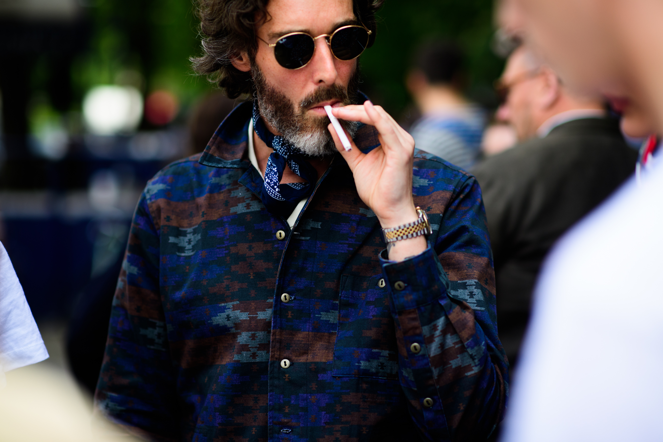 A man smoking before the fashion show