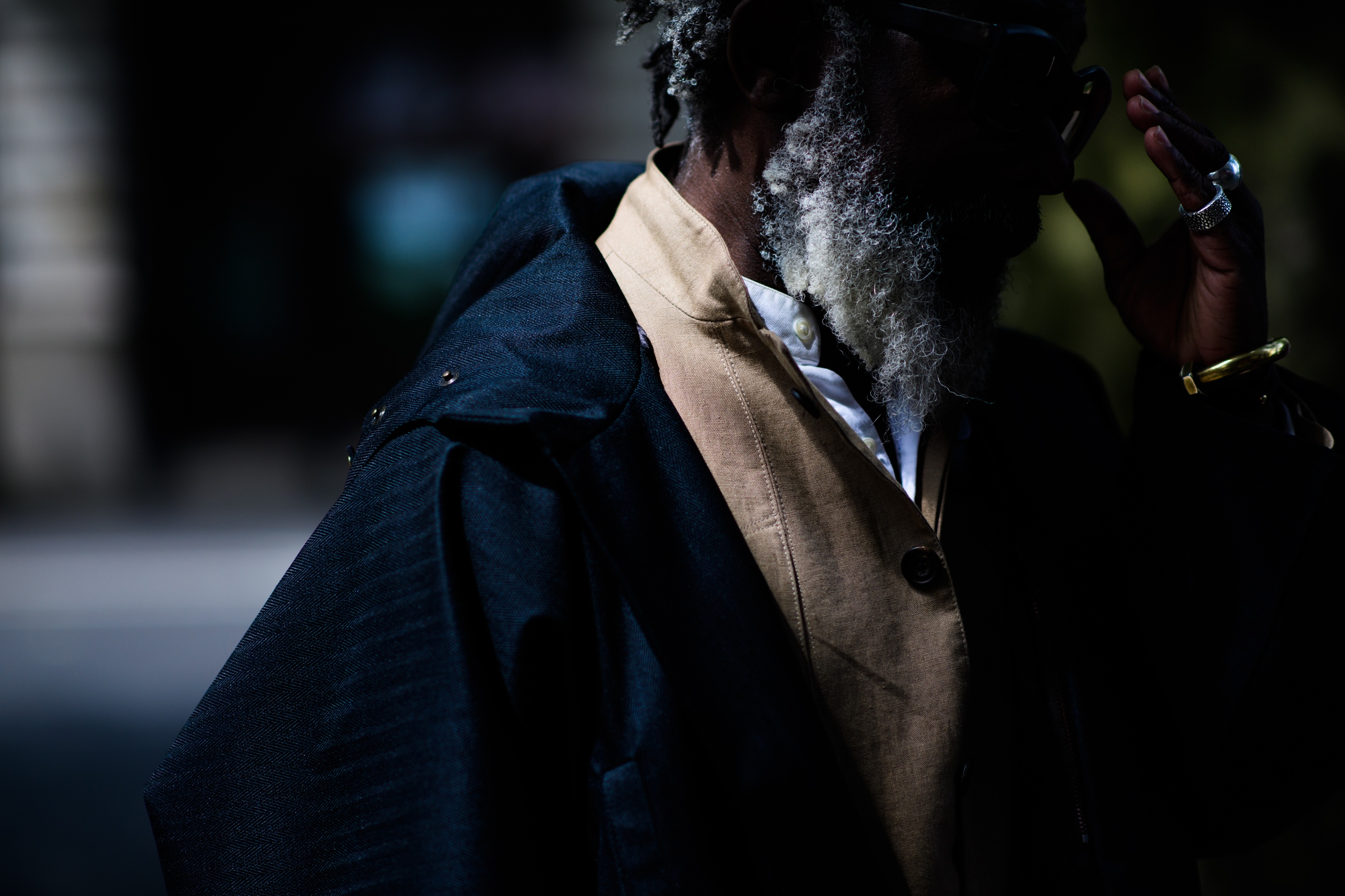 A man in a camel and black jacket