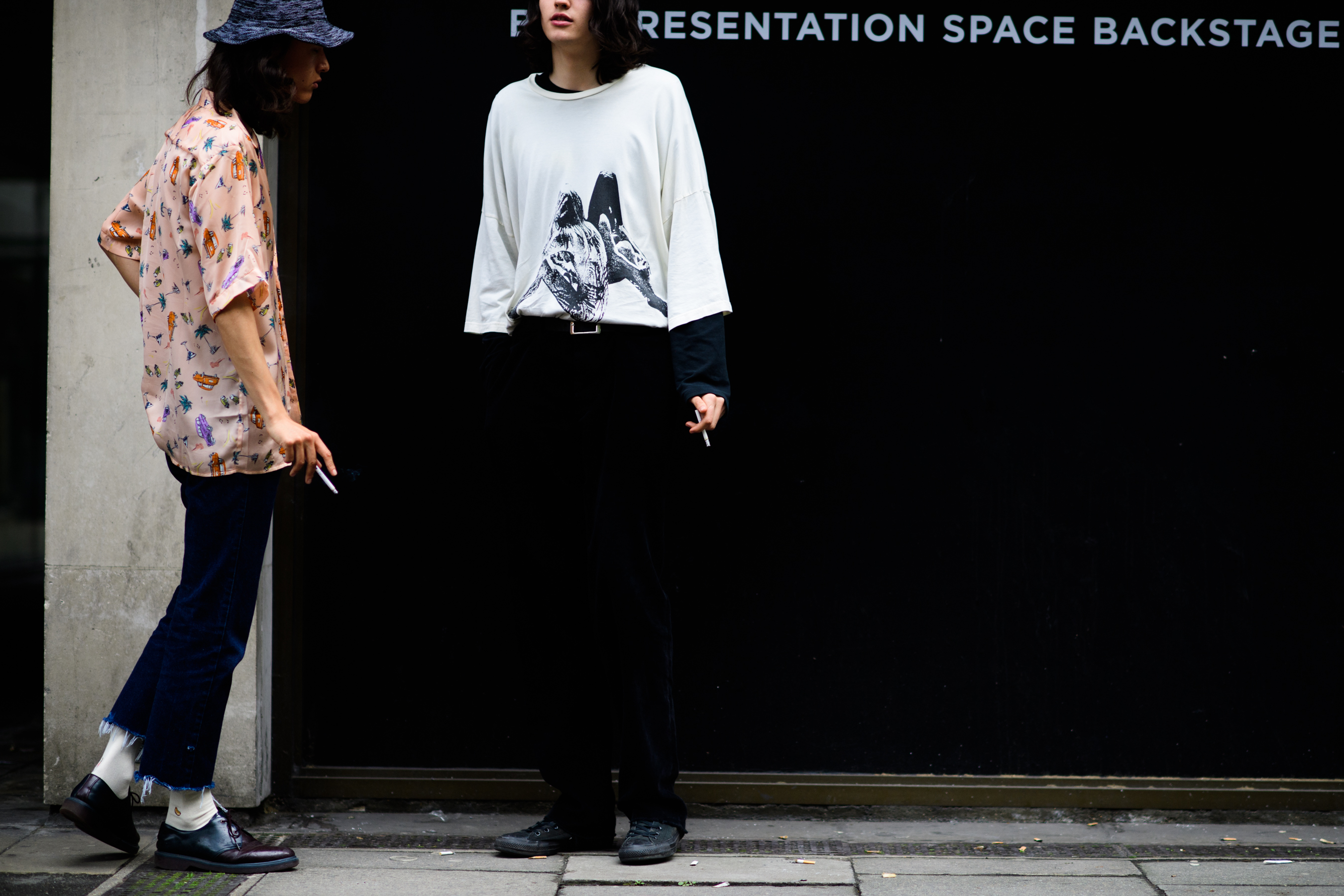 Two models hanging out outside