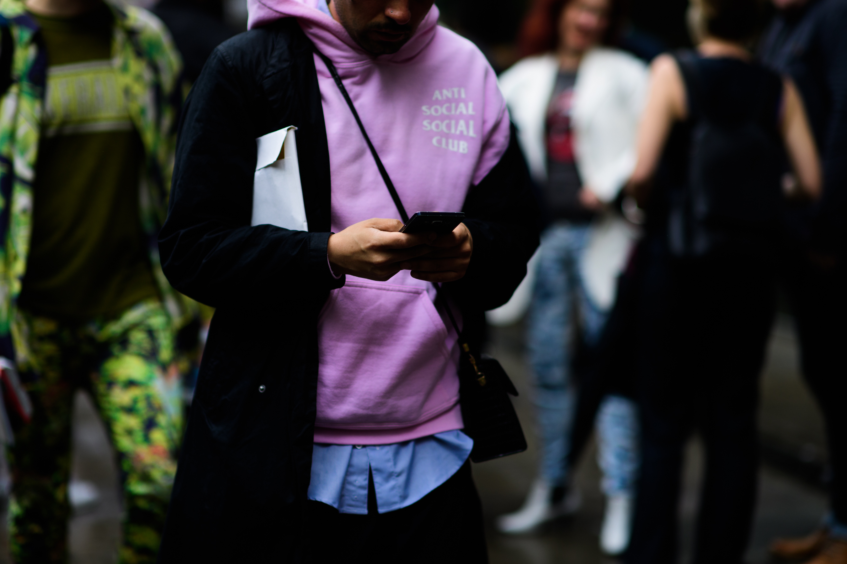 A man in a purple sweatshirt