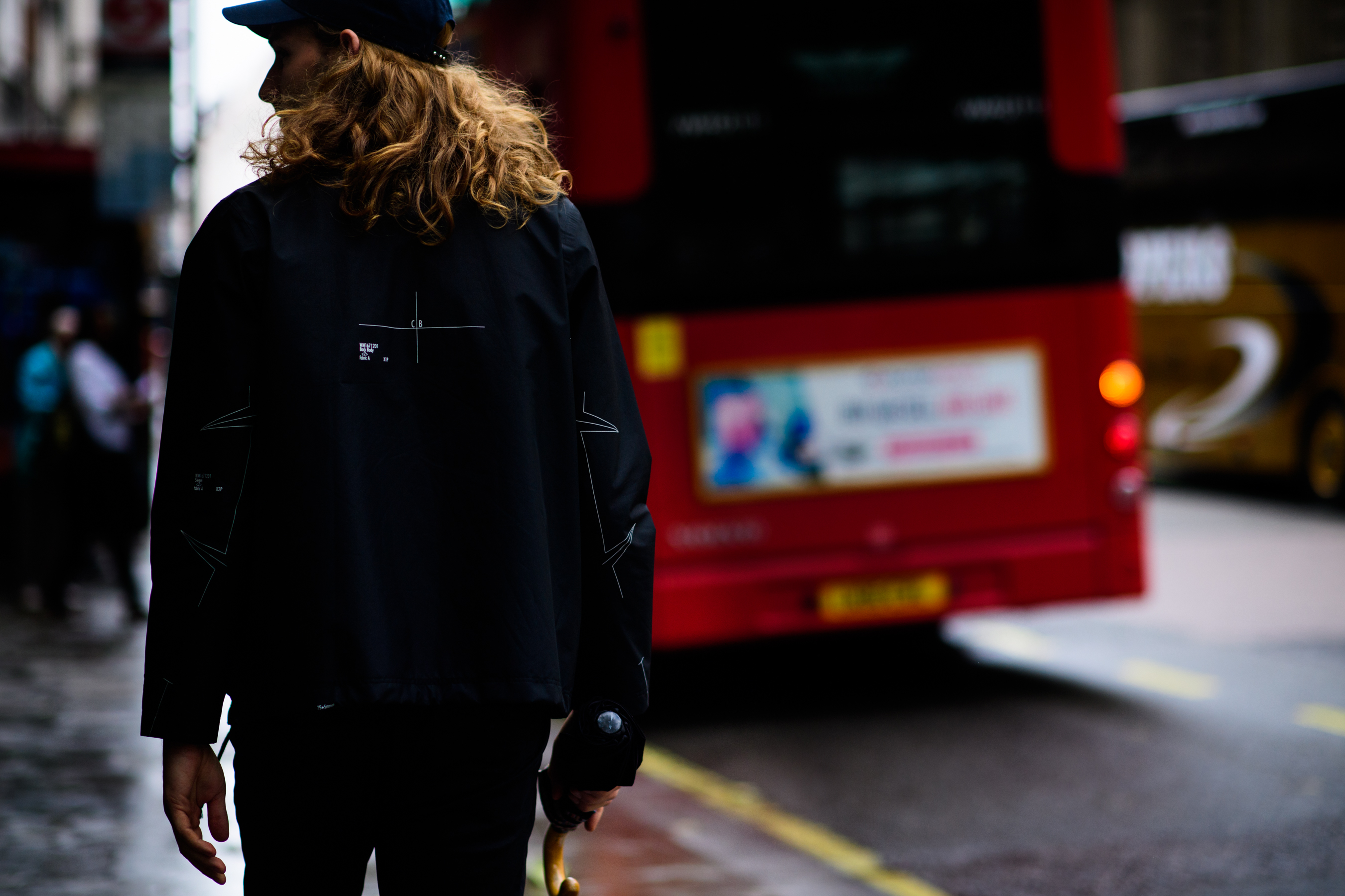 A model walking in a black outfit