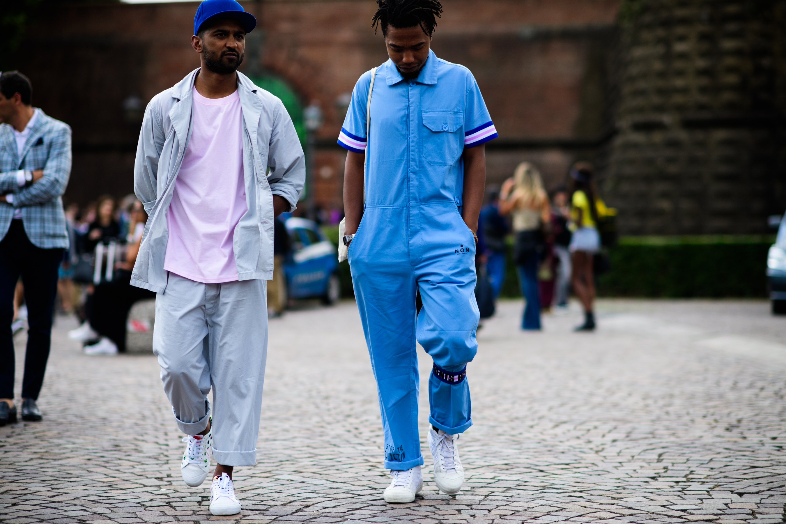 Two men wearing blue suits