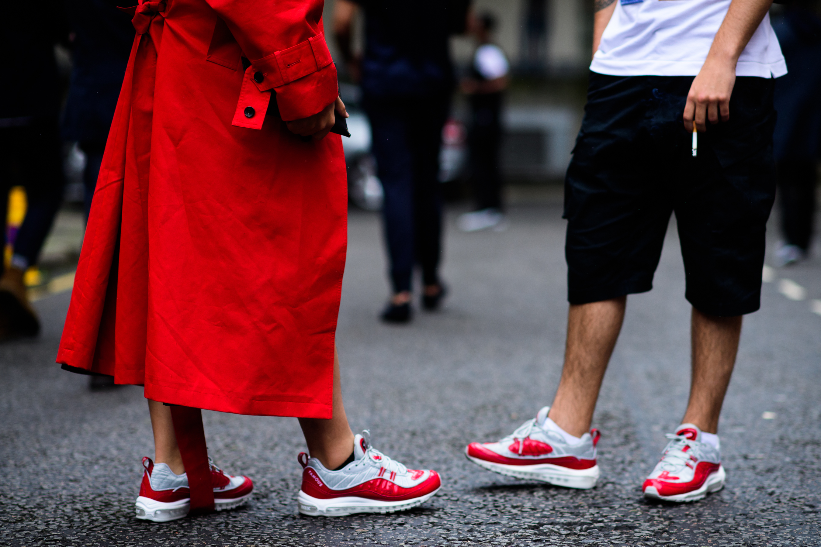 Men wearing red and white sneakers