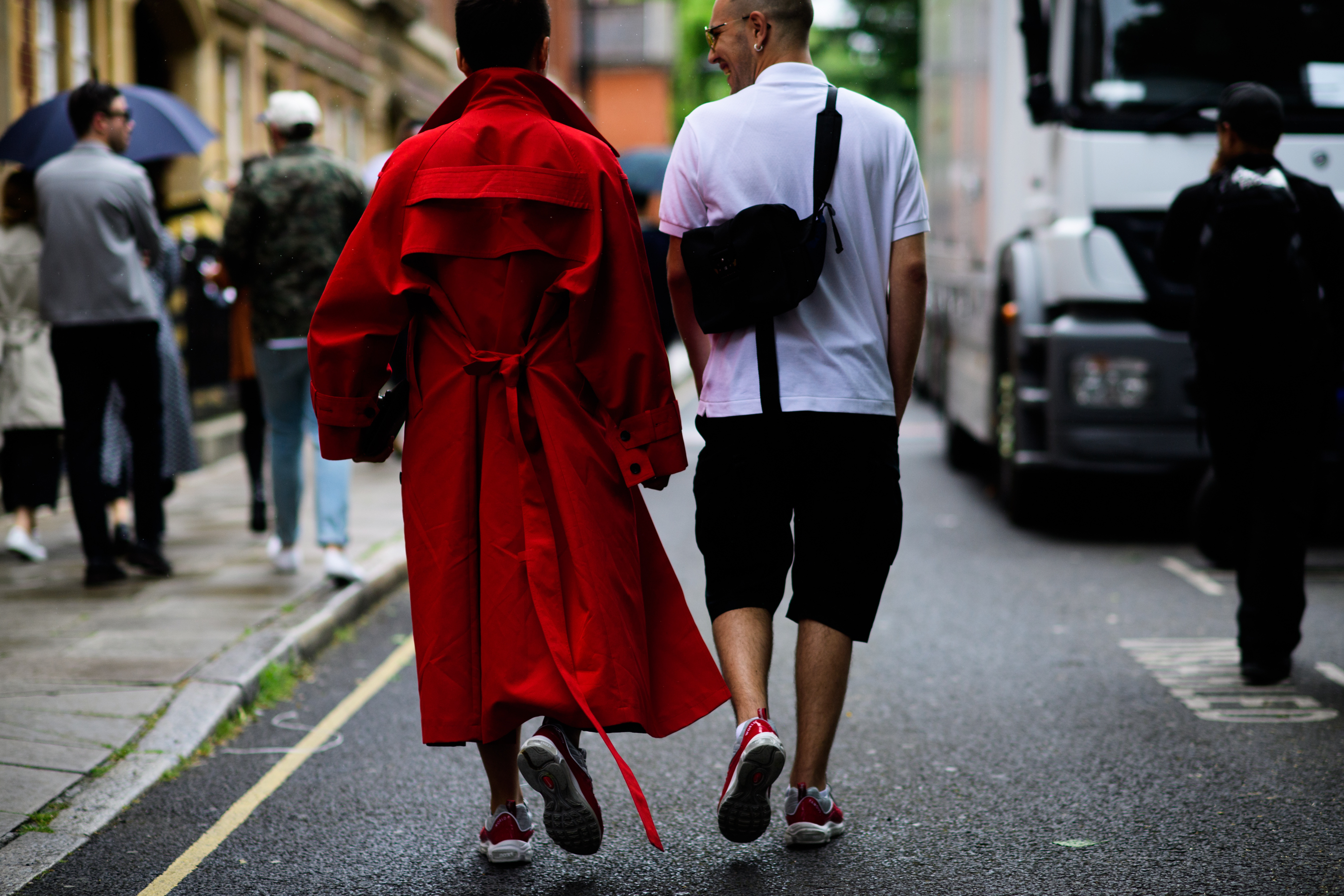 Two men walking in between shows