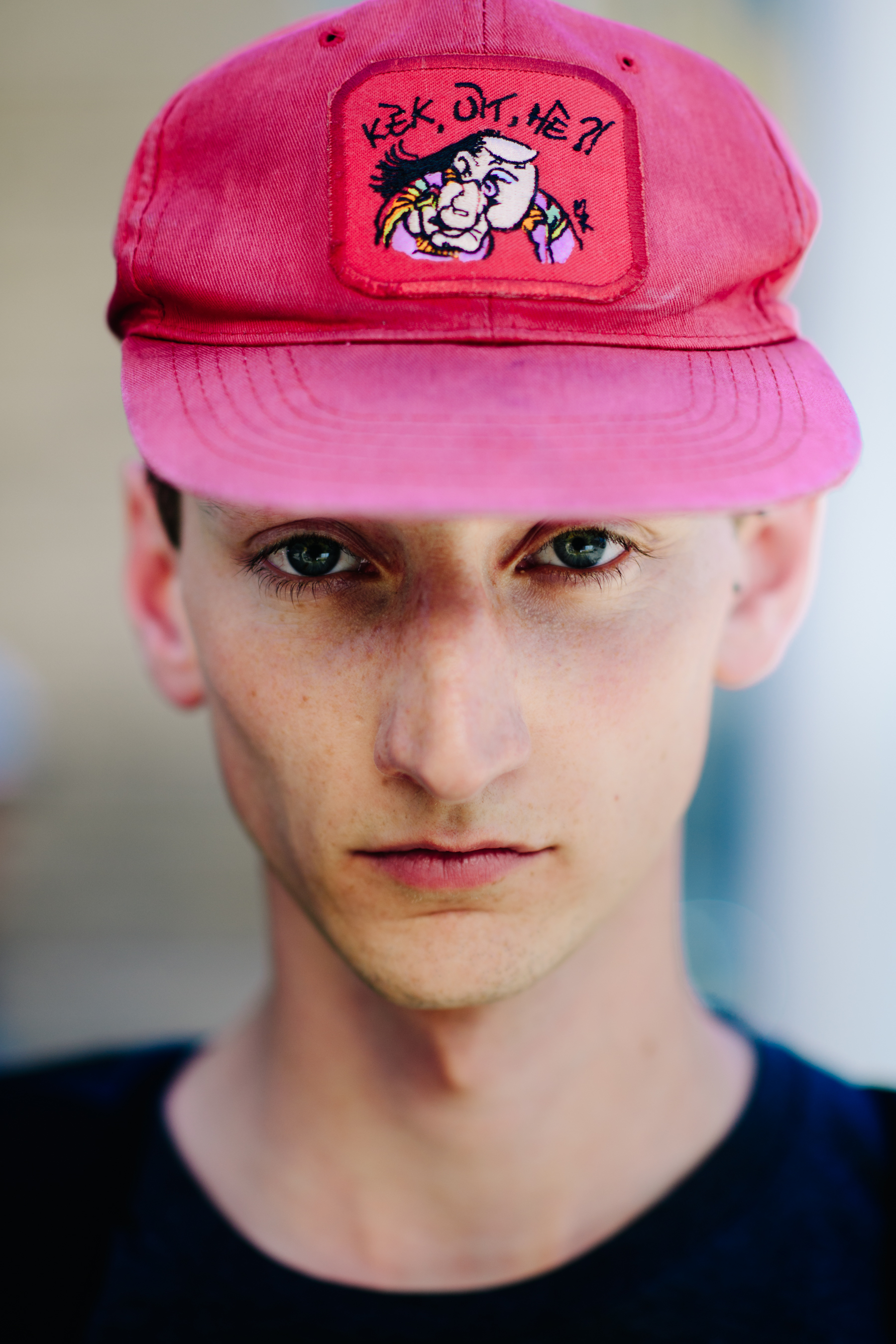Young man wearing a pink cap