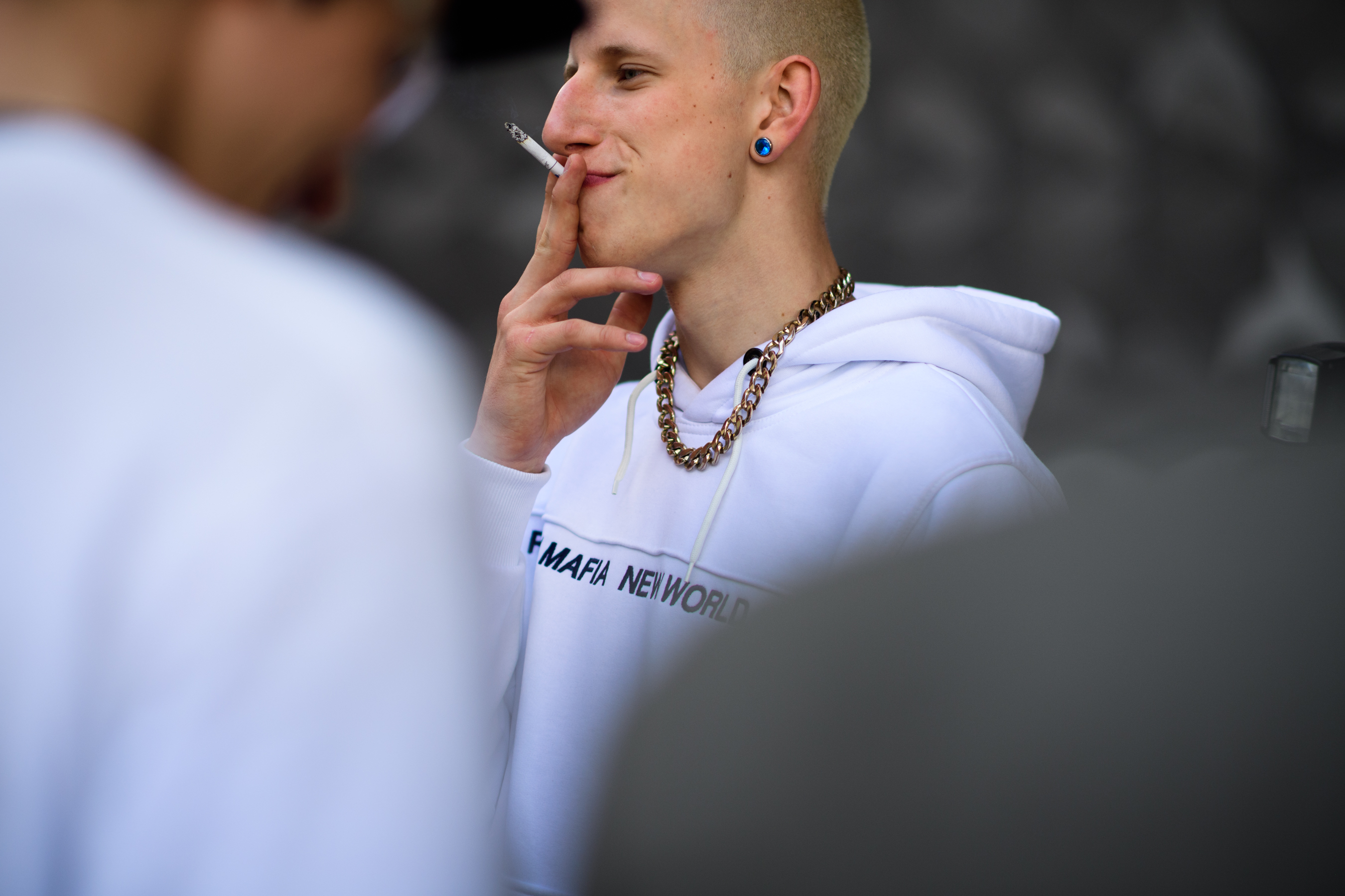 Male model wearing white sweatshirt