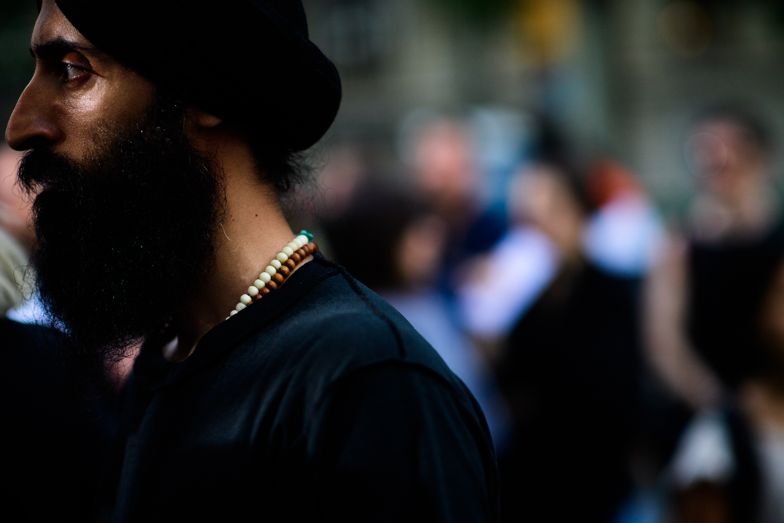 A man in black with accessories