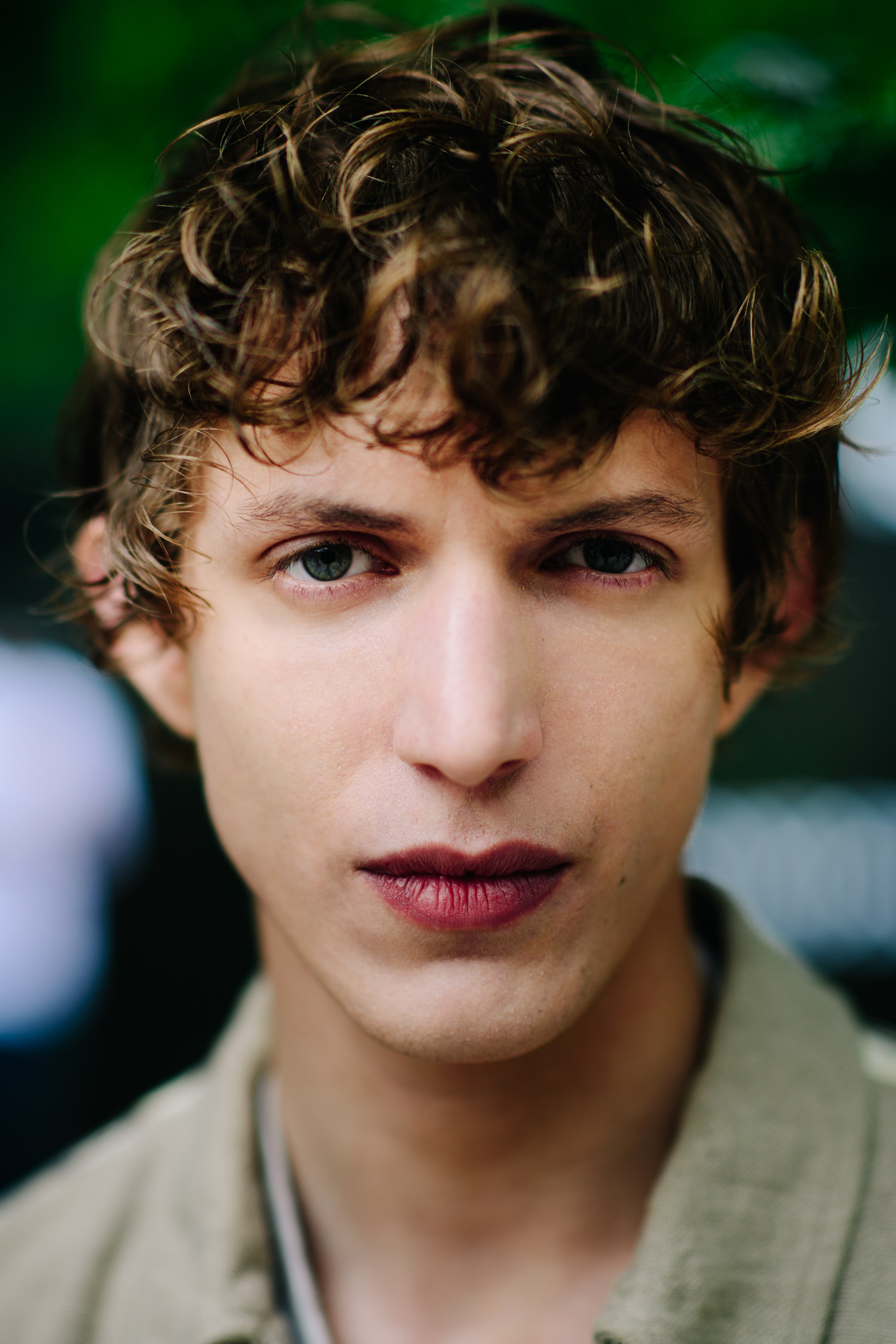 A man with blond curly hair
