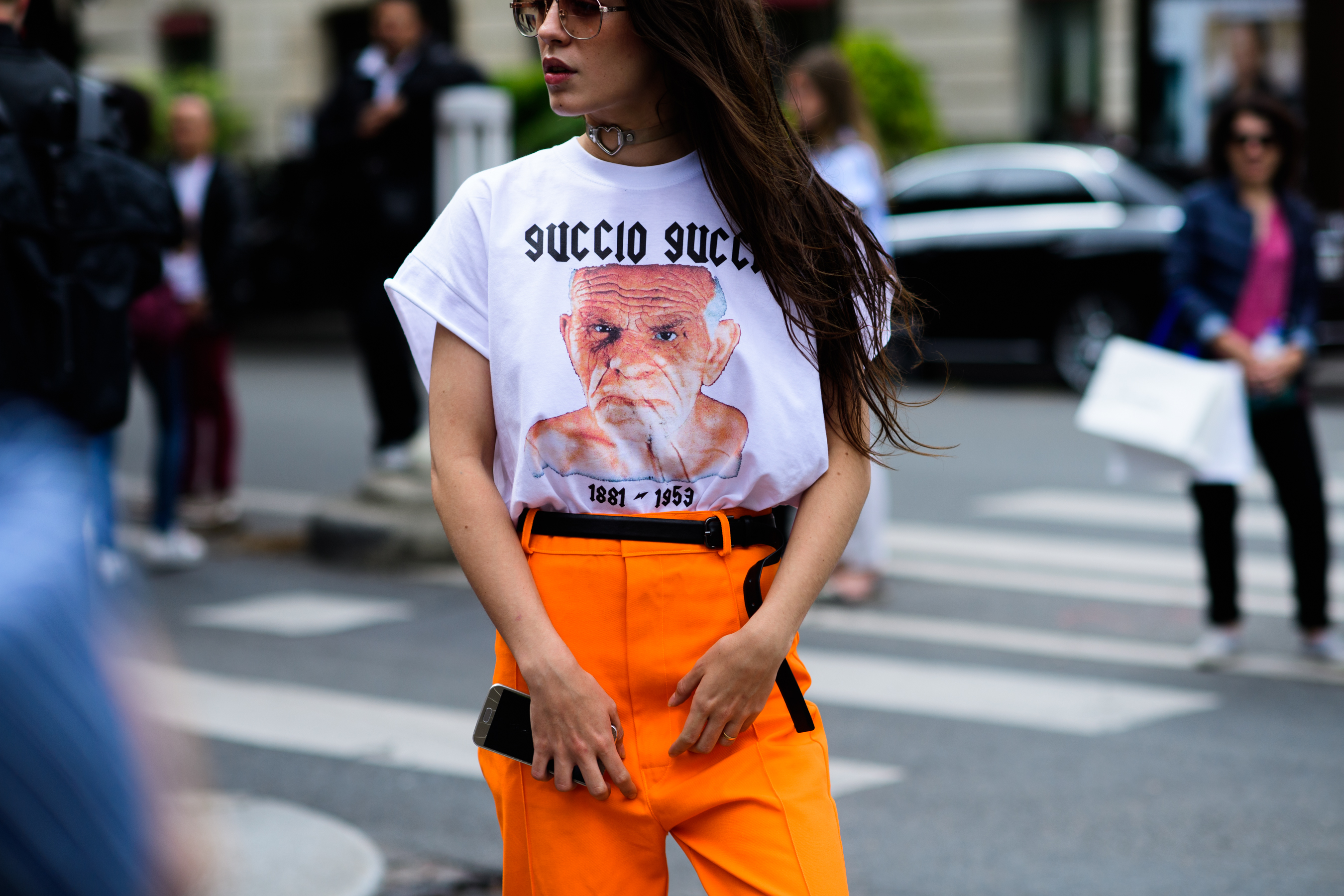 Woman wearing bright orange trousers