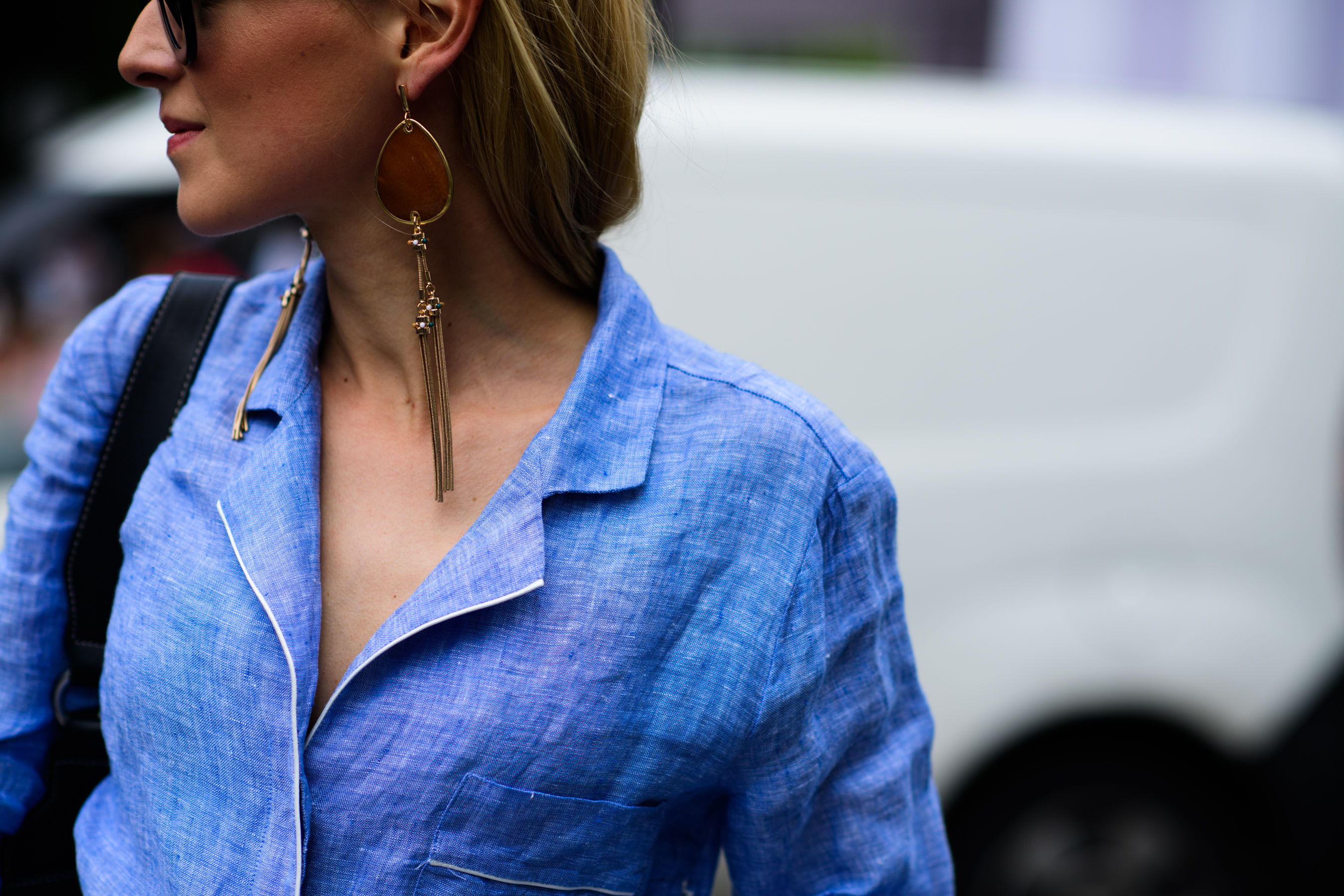 Woman wearing drop shaped earrings