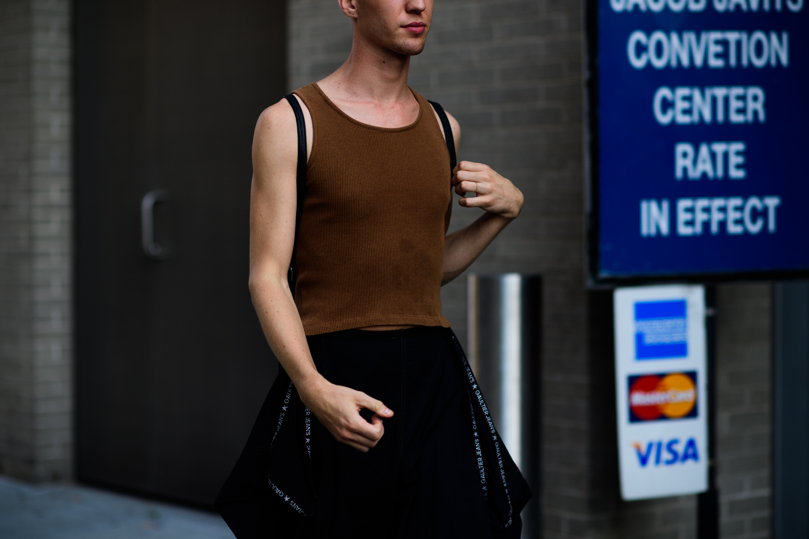 Man wearing brown tank top