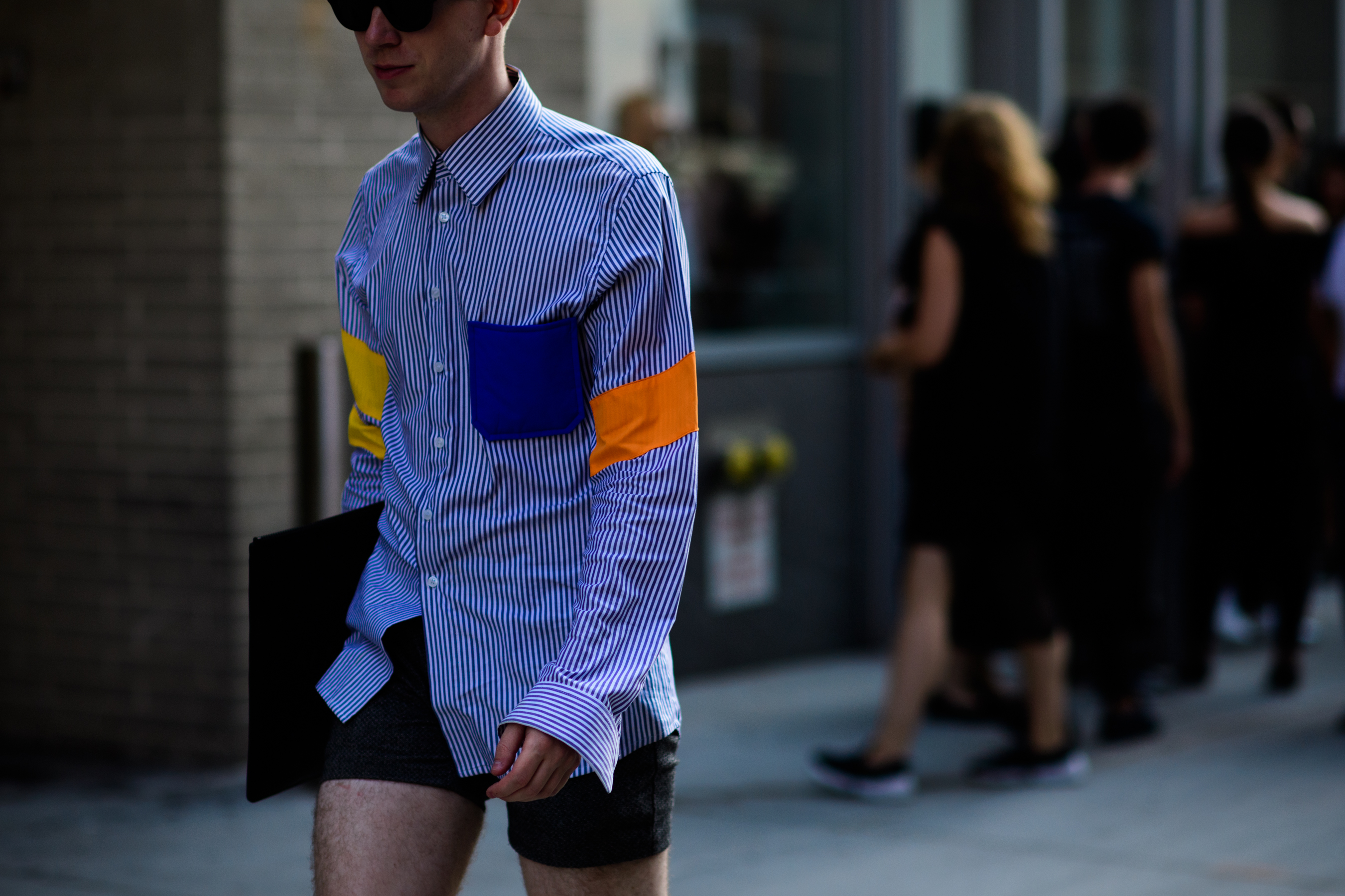 Man wearing colorful patches shirt