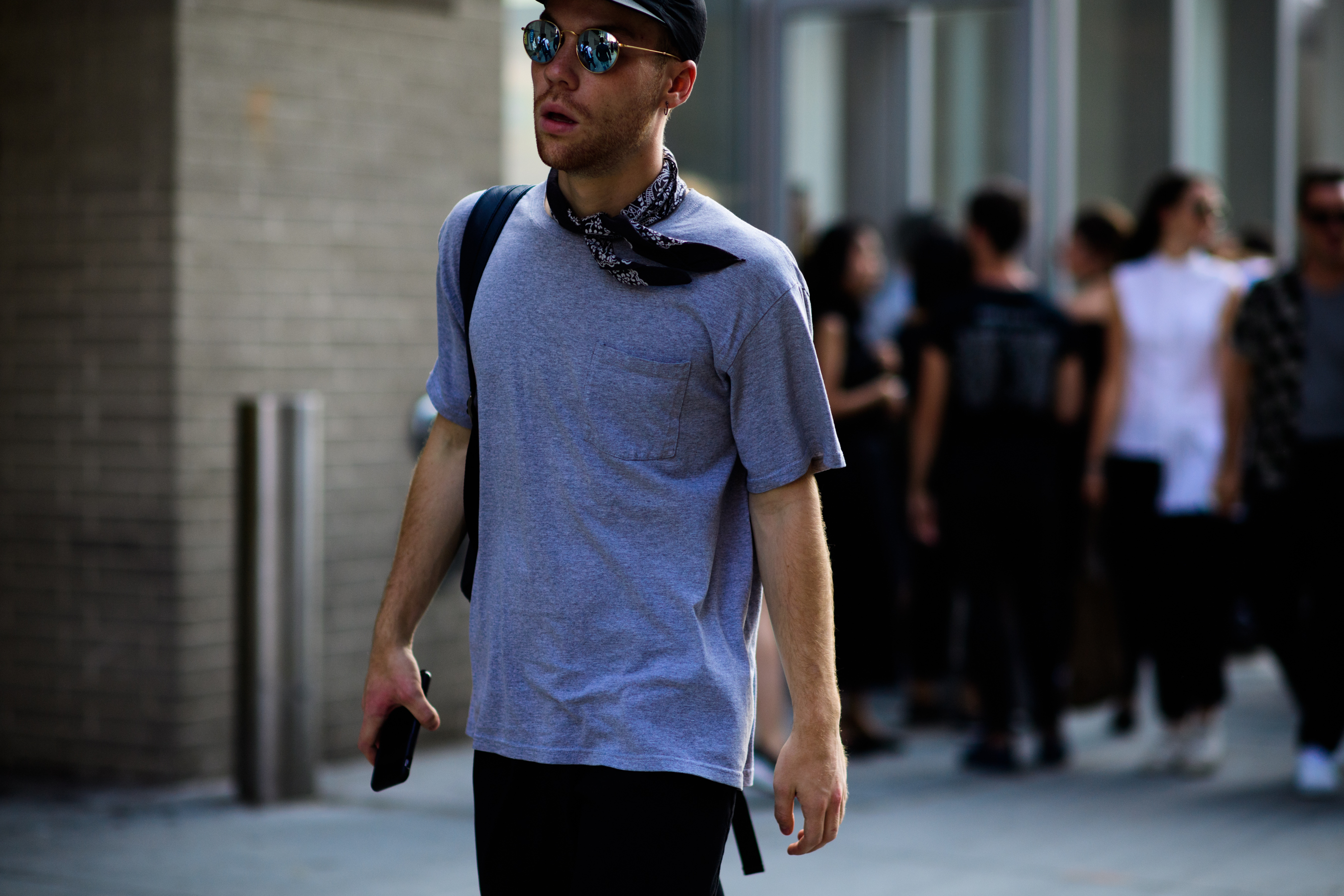 Man wearing neck bandana and glasses