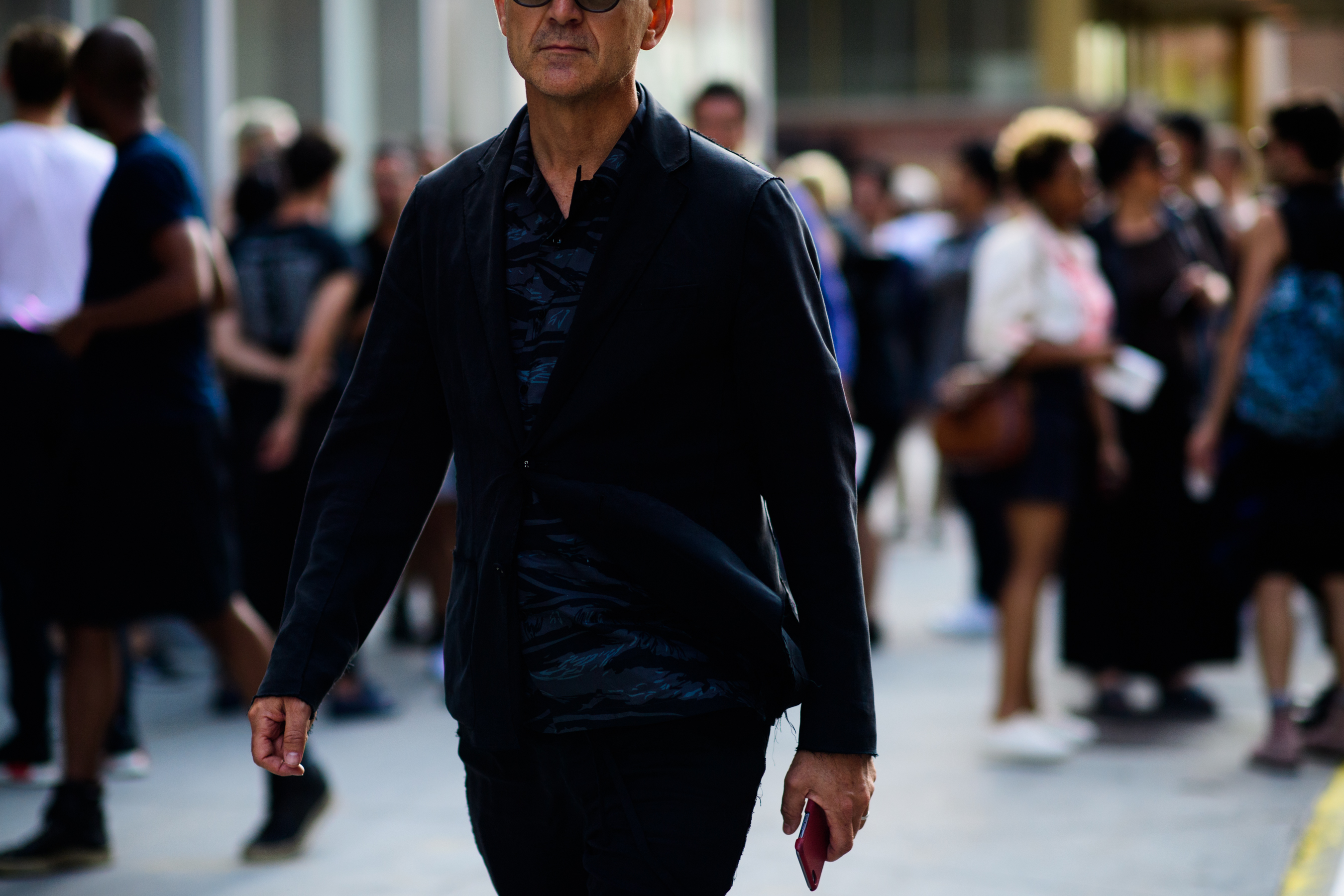 Man wearing suit with dark shirt