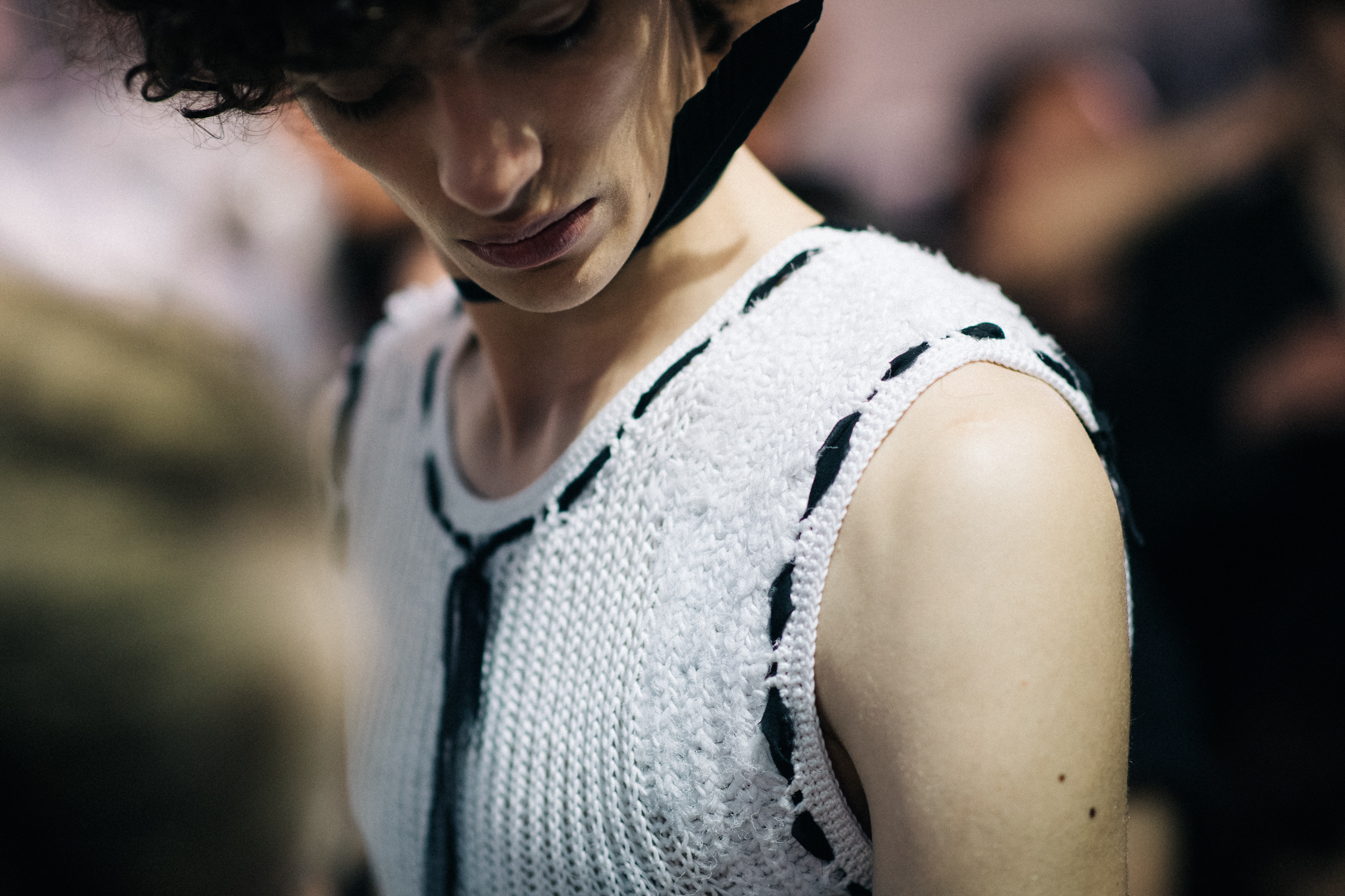 Male model wearing white vest
