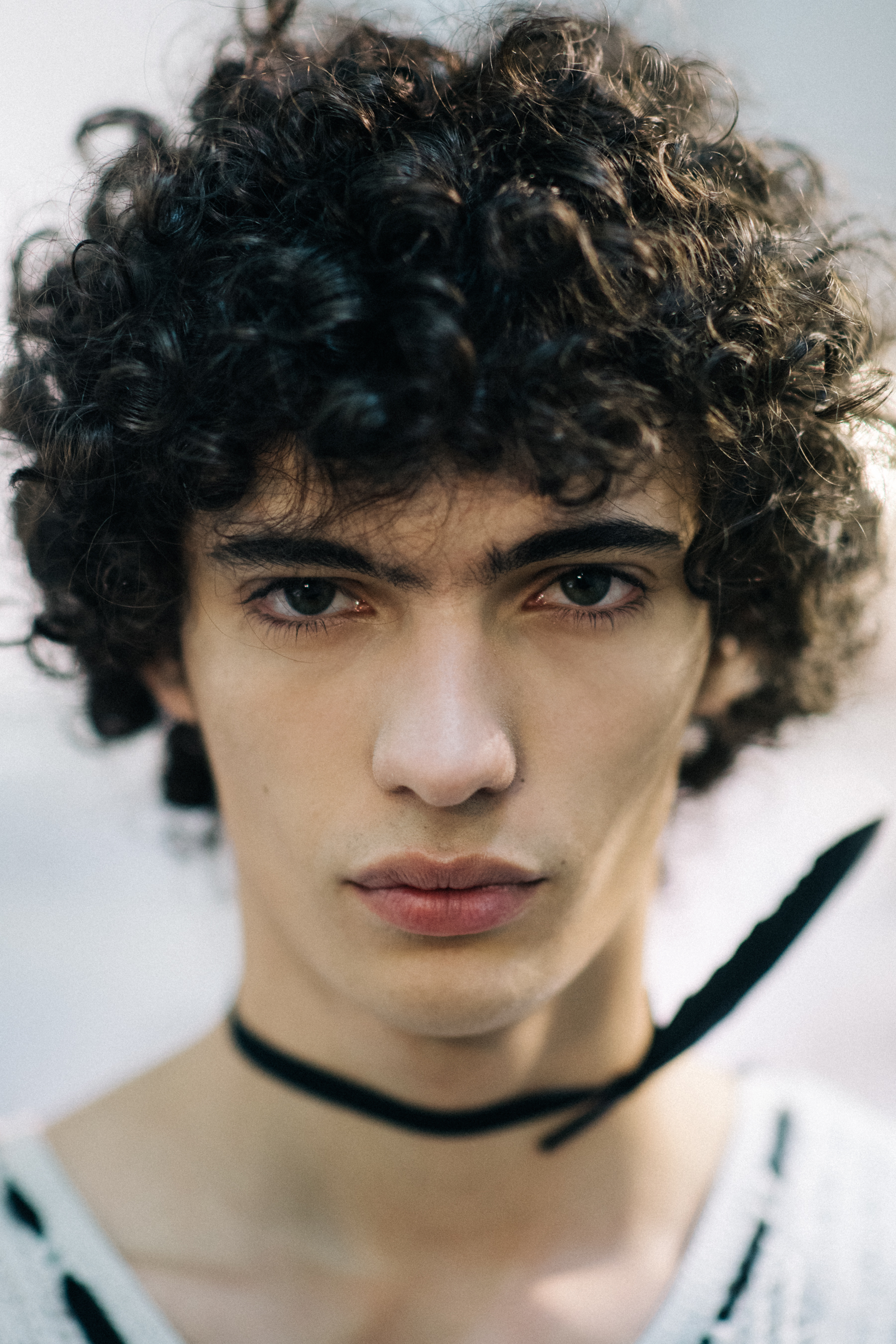 Dark curly-haired male model
