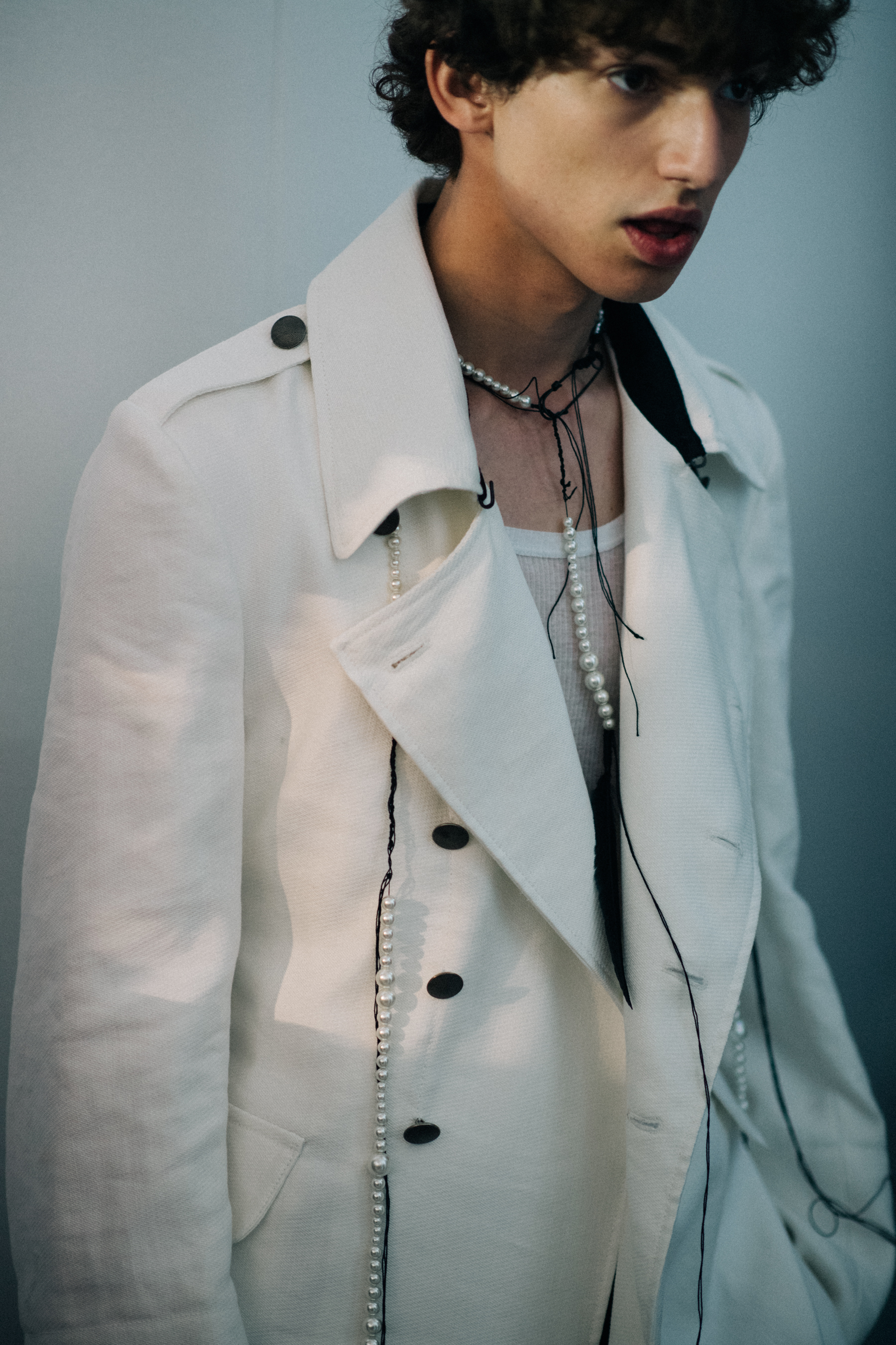Model wearing white jacket