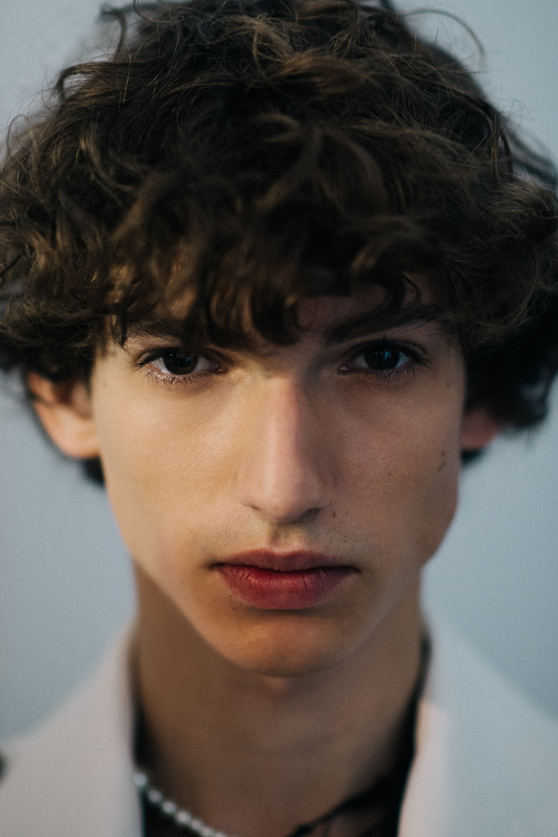 Curly-haired male model portrait