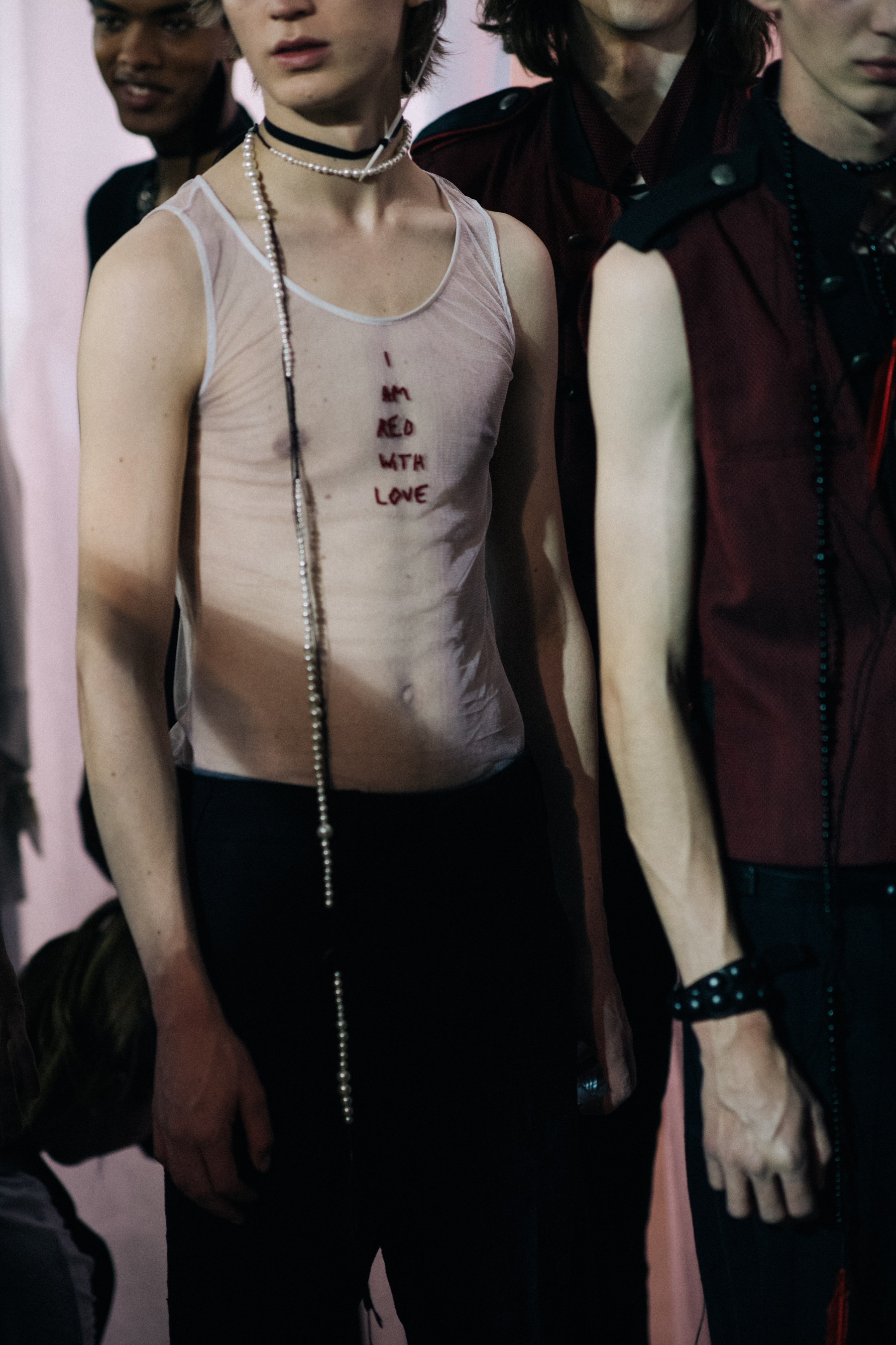 Male models posing before show