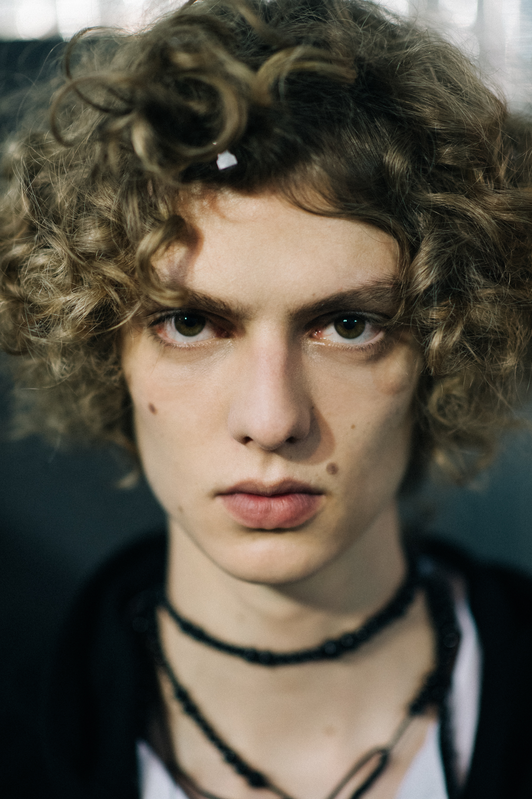 Blond curly-haired male model