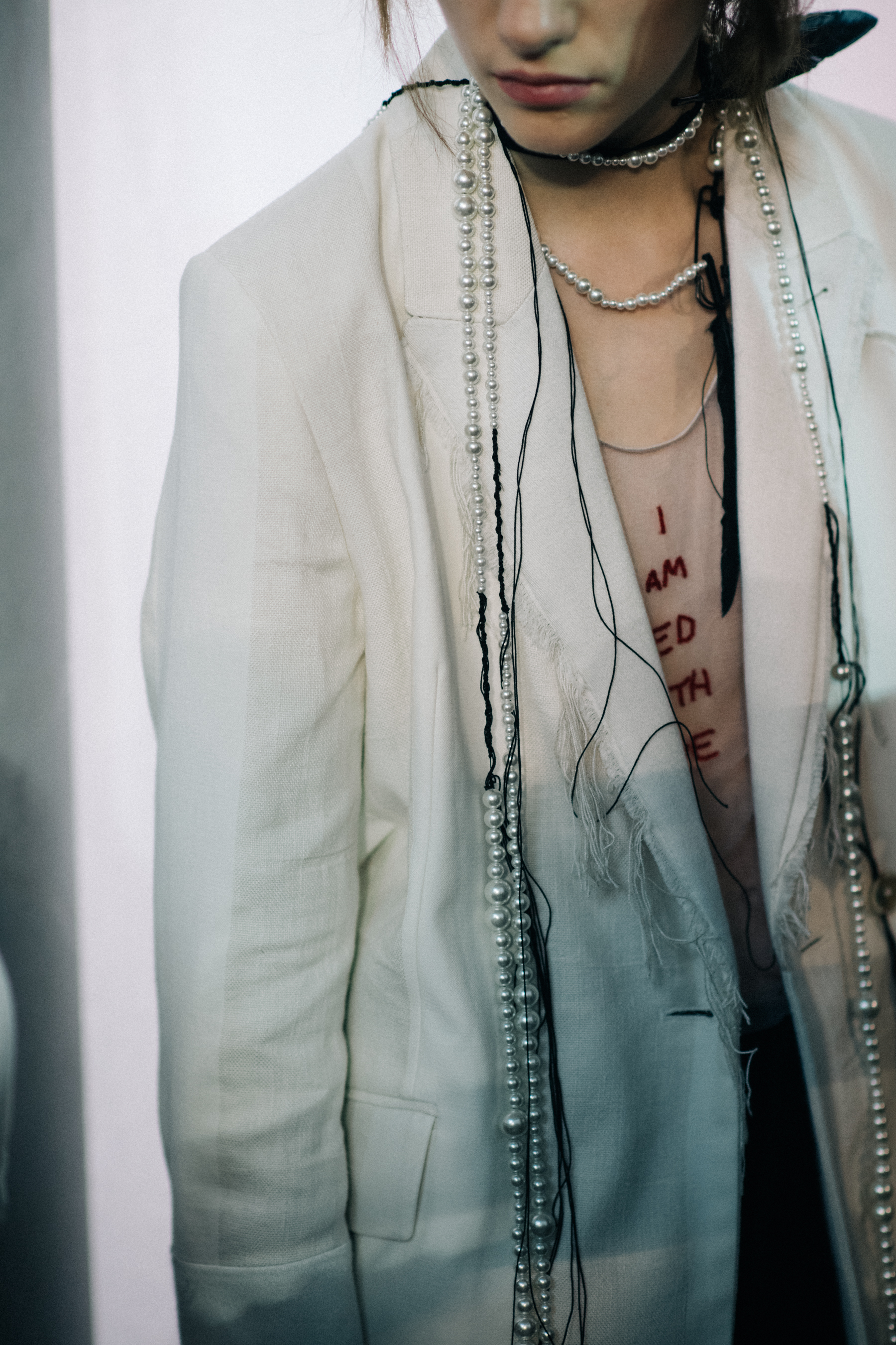 Male model wearing beige jacket