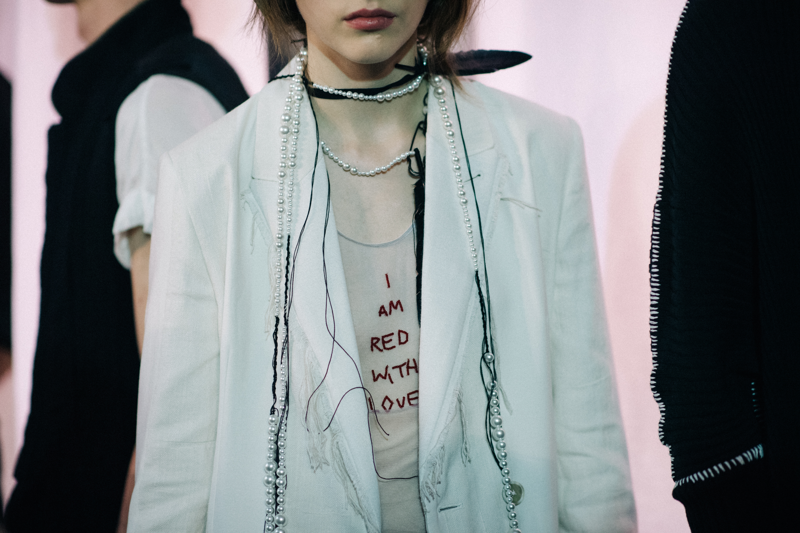 Model wearing white jacket