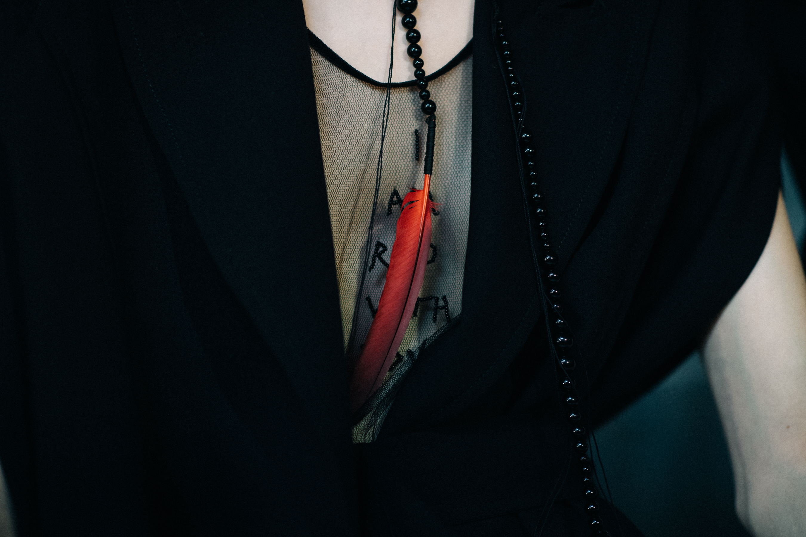 Black jacket with red accessories