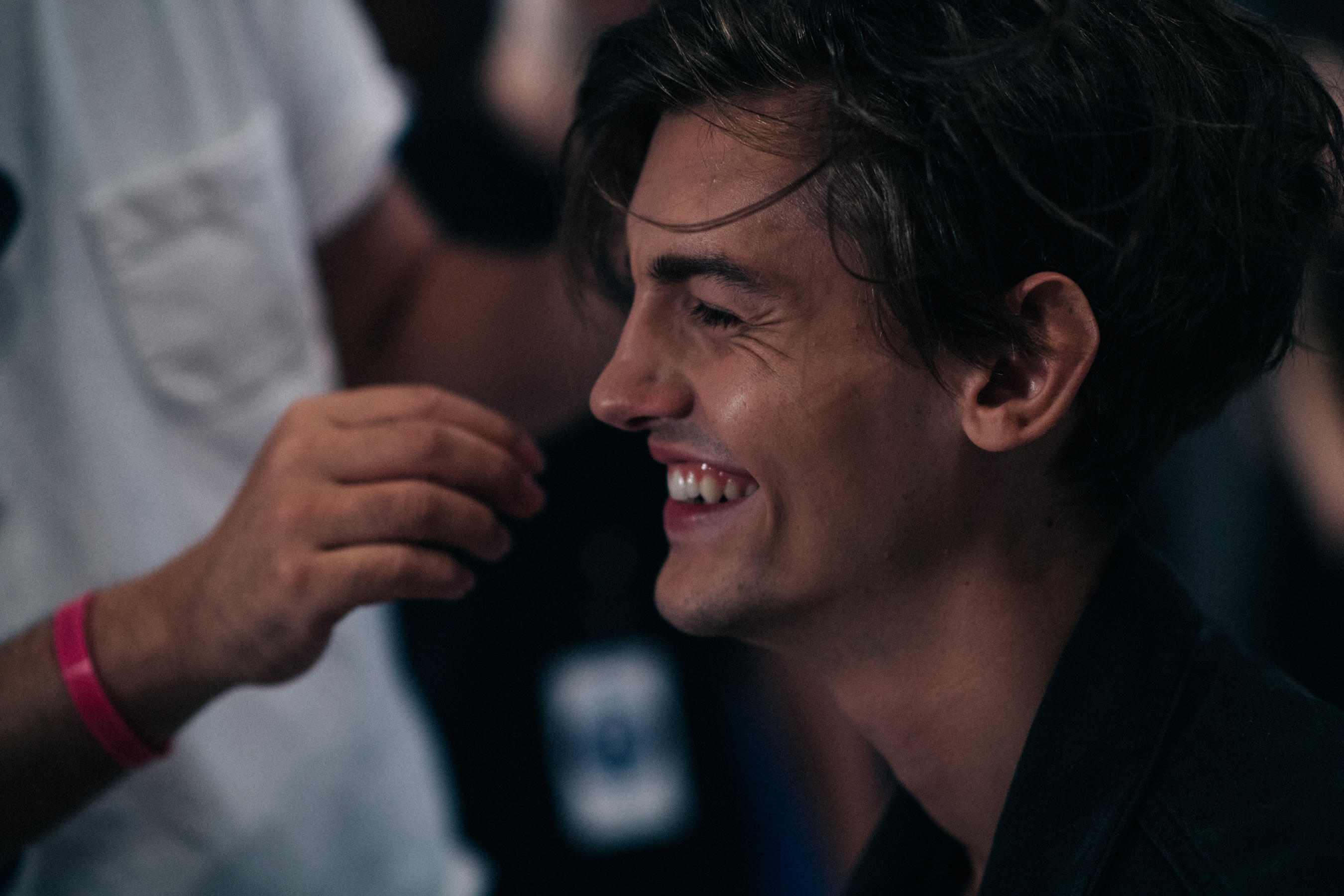 Male model laughing before show