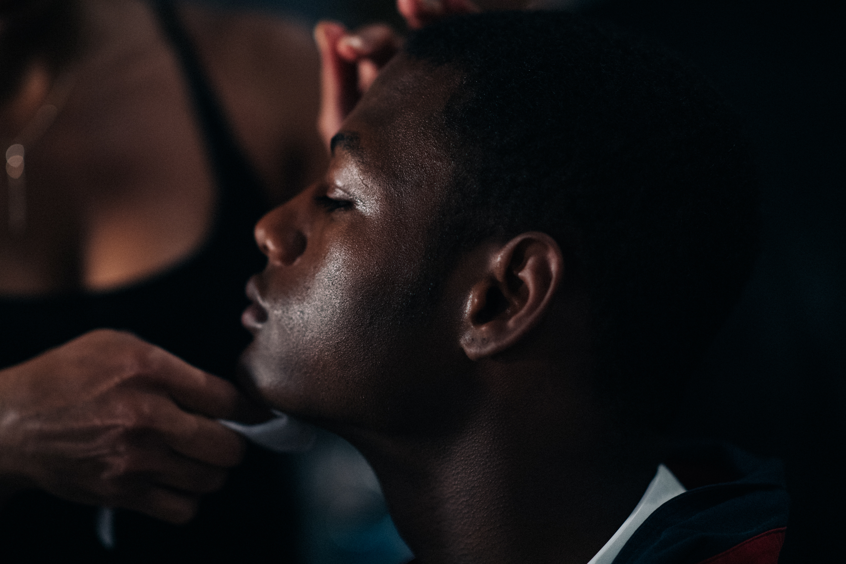 Male model getting make up done