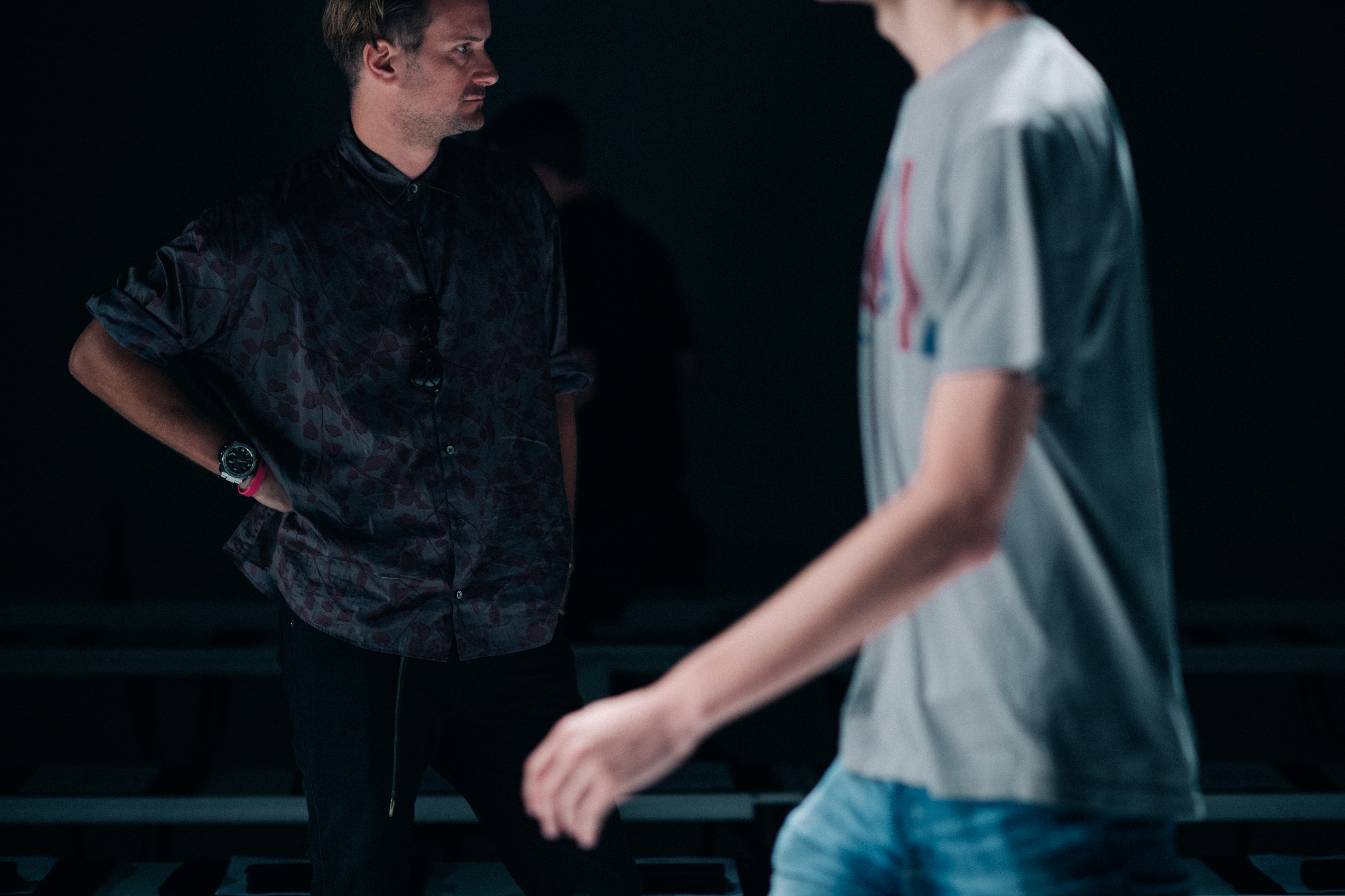 Designer watching his show rehearsal